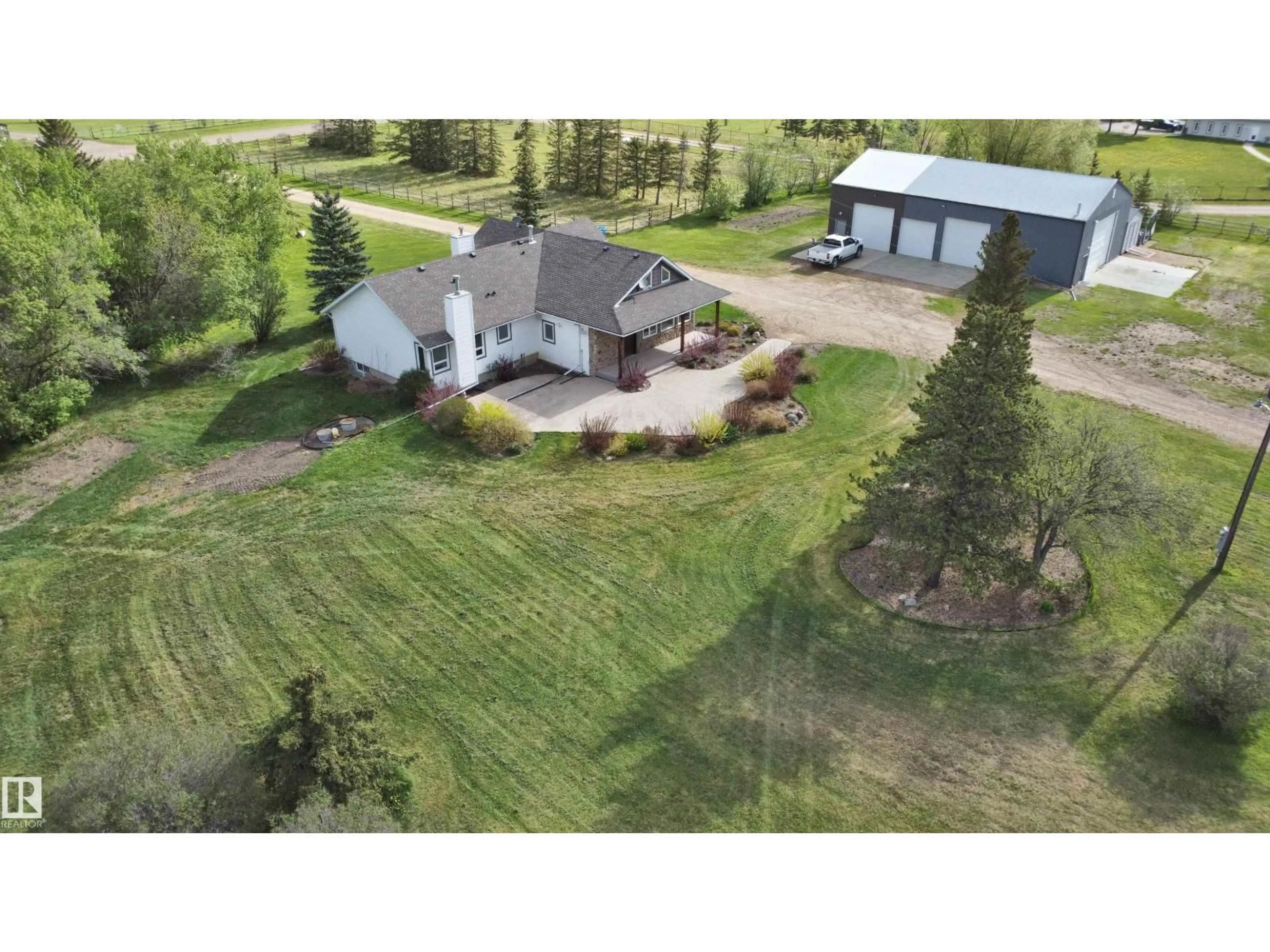 A pic from outside/outdoor area/front of a property/back of a property/a pic from drone, unknown for 26317 TWP ROAD 552, Rural Sturgeon County Alberta T8R1T4