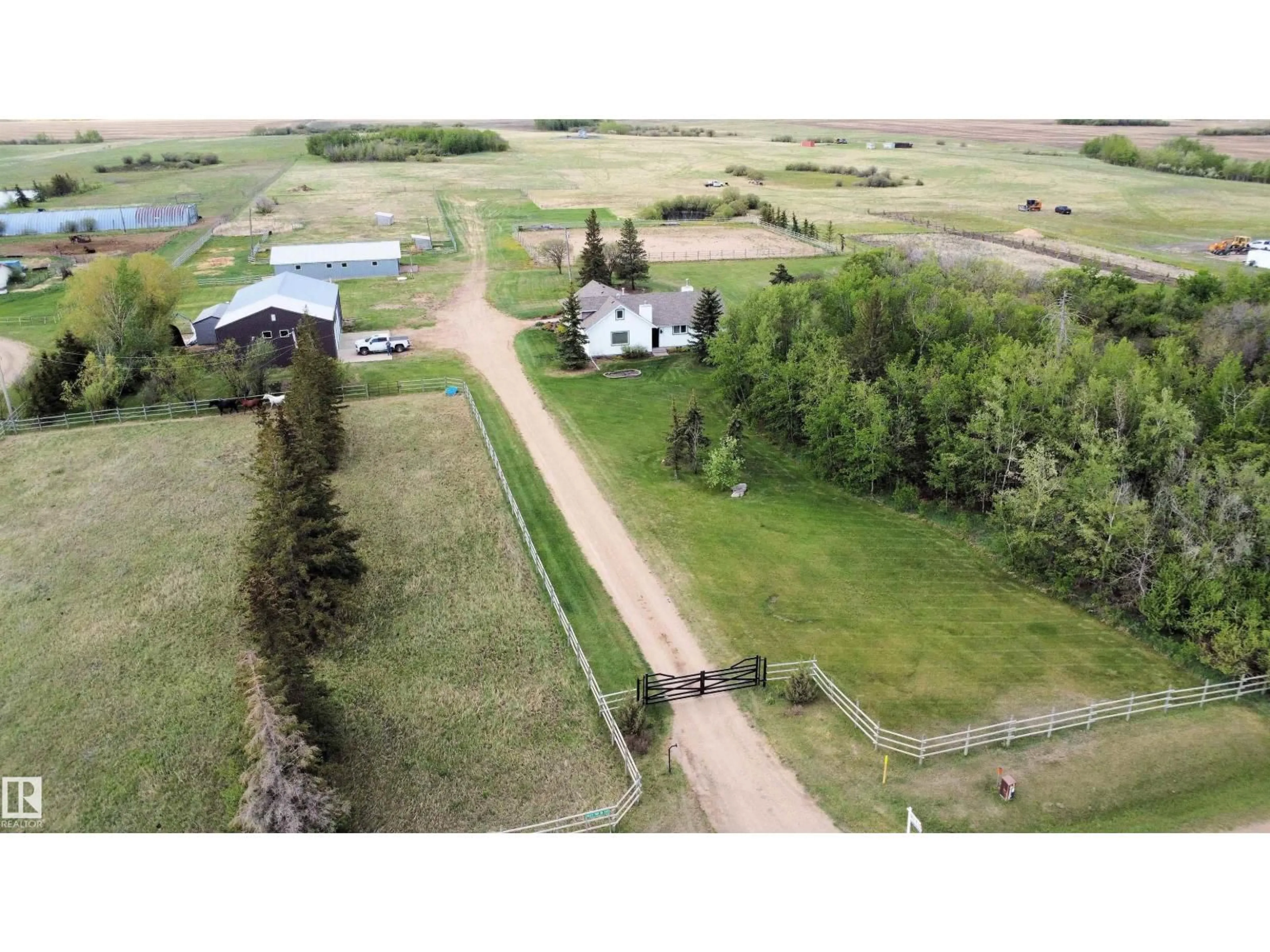 A pic from outside/outdoor area/front of a property/back of a property/a pic from drone, unknown for 26317 TWP ROAD 552, Rural Sturgeon County Alberta T8R1T4