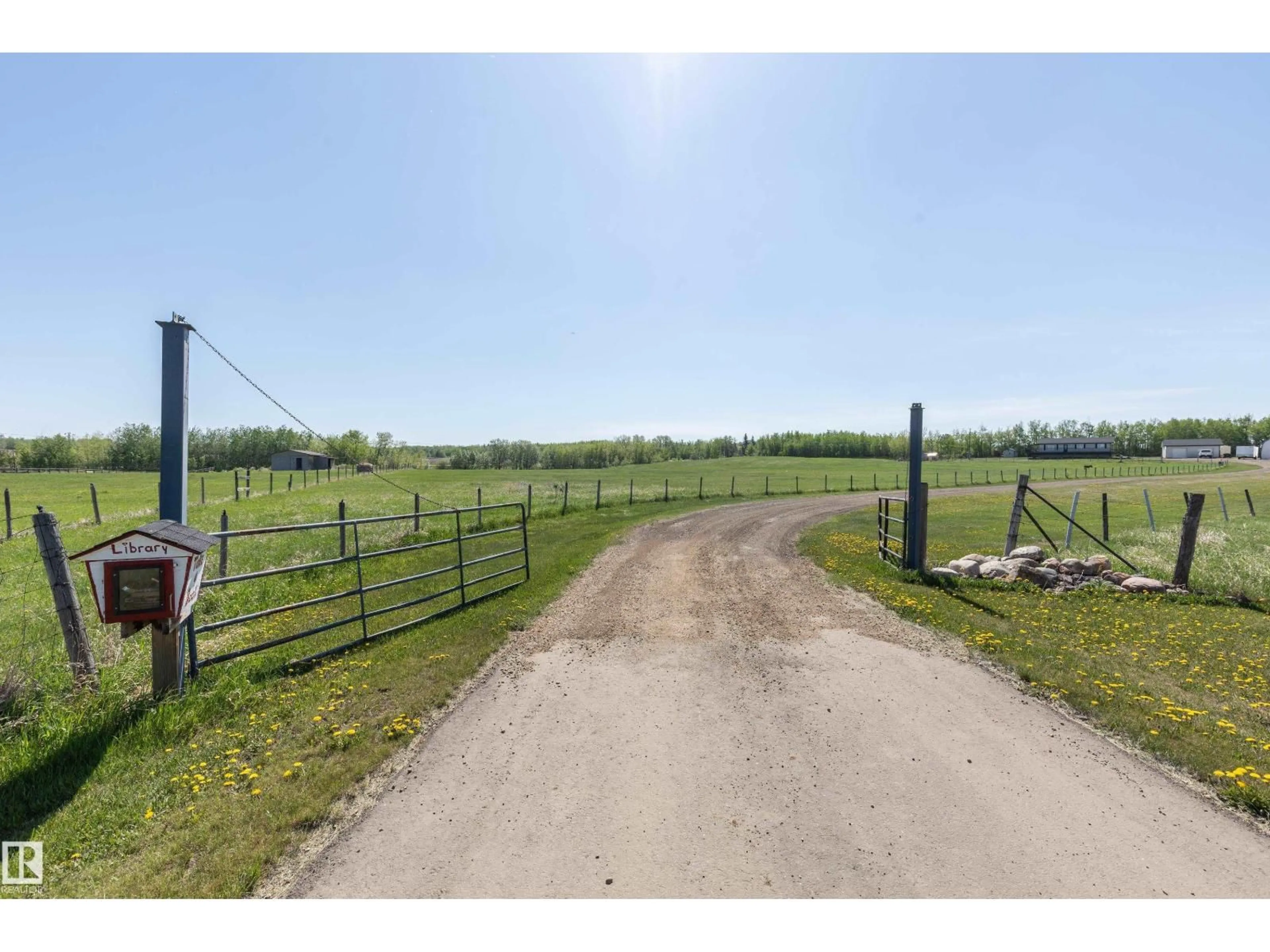 A pic from outside/outdoor area/front of a property/back of a property/a pic from drone, street for 90 22111 TWP RD, Rural Leduc County Alberta T0B3M2