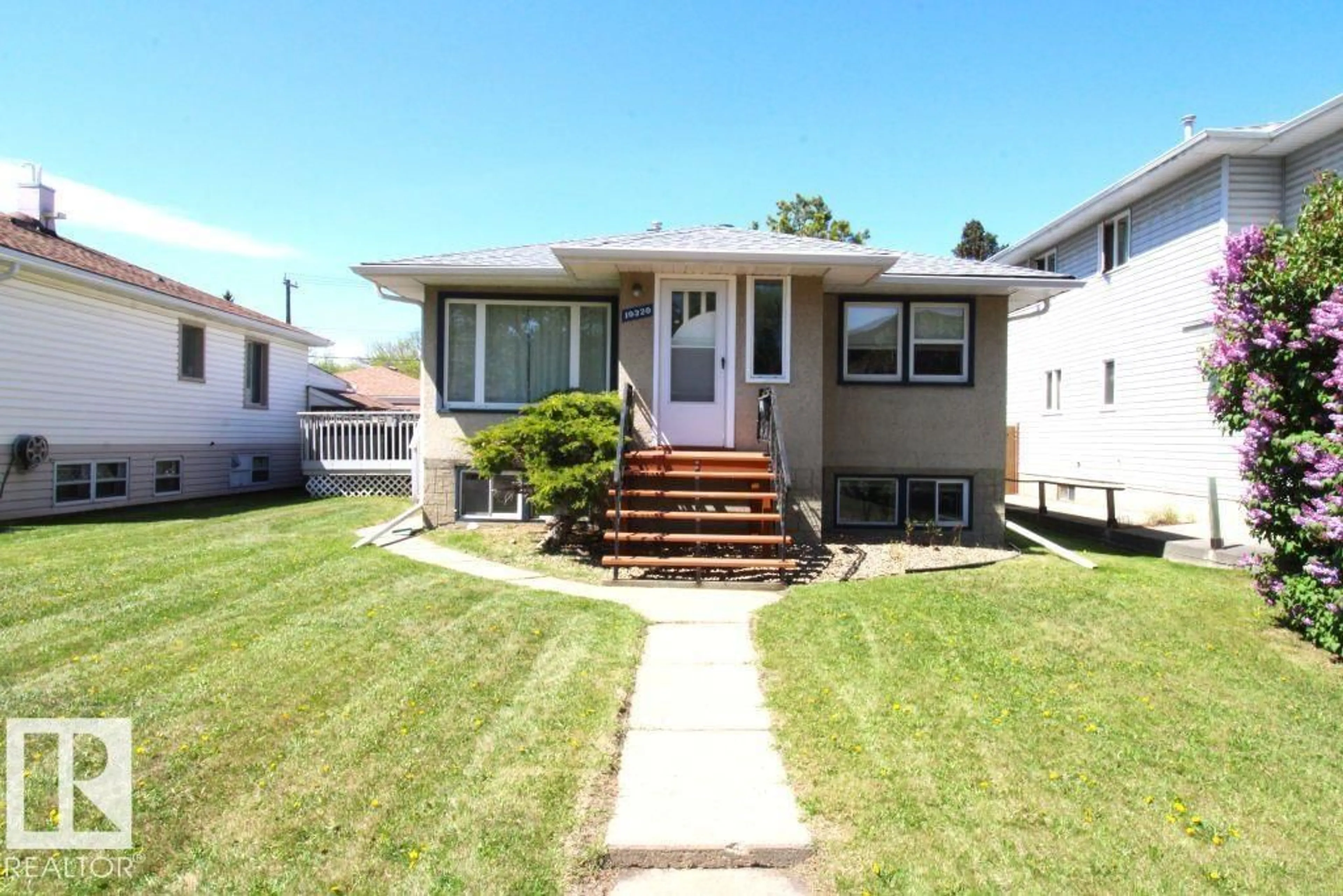 Home with vinyl exterior material, street for 10320 79 ST, Edmonton Alberta T6A3G8