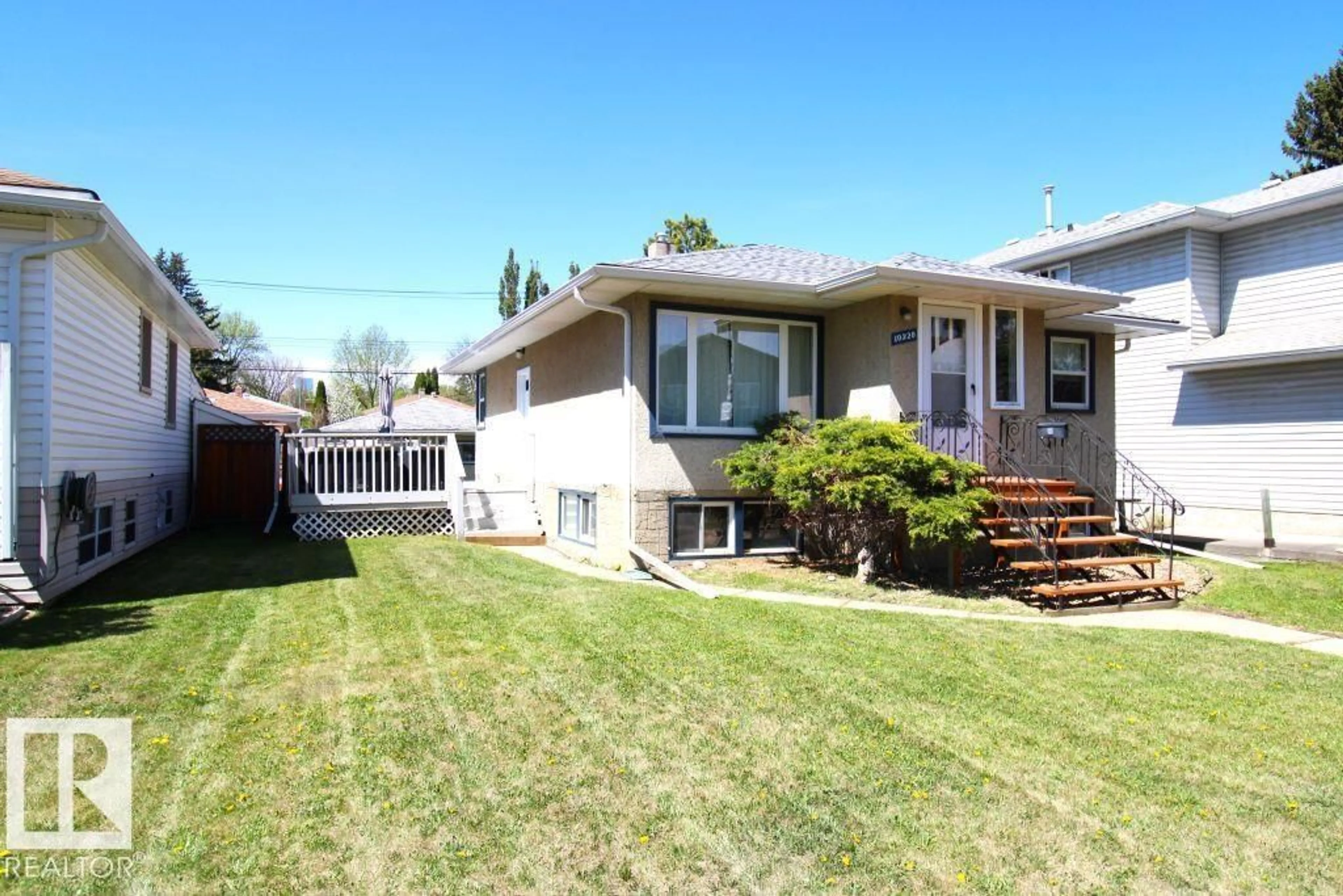 Home with vinyl exterior material, street for 10320 79 ST, Edmonton Alberta T6A3G8