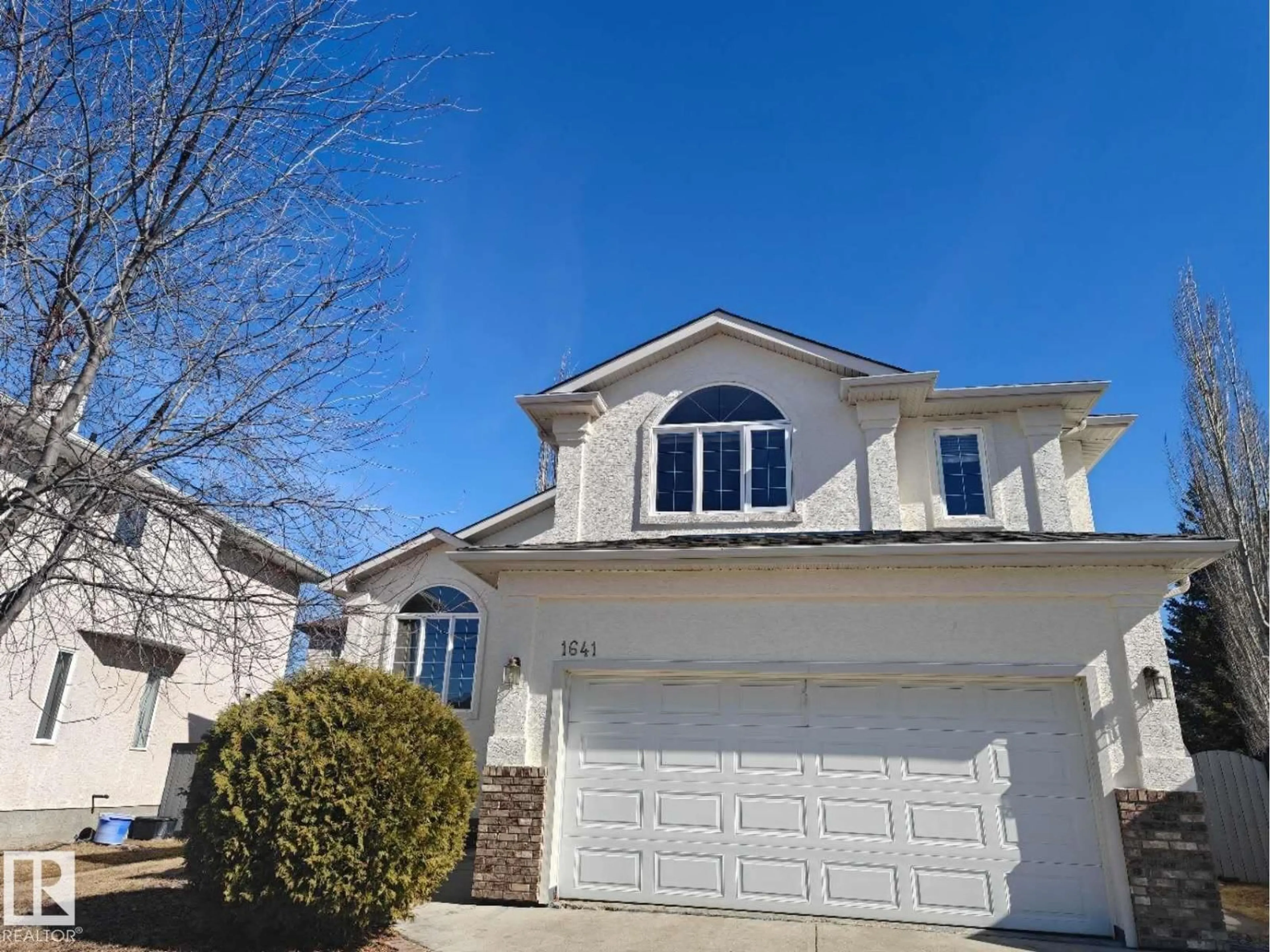 Home with vinyl exterior material, street for 1641 FORBES WY, Edmonton Alberta T6R2R9
