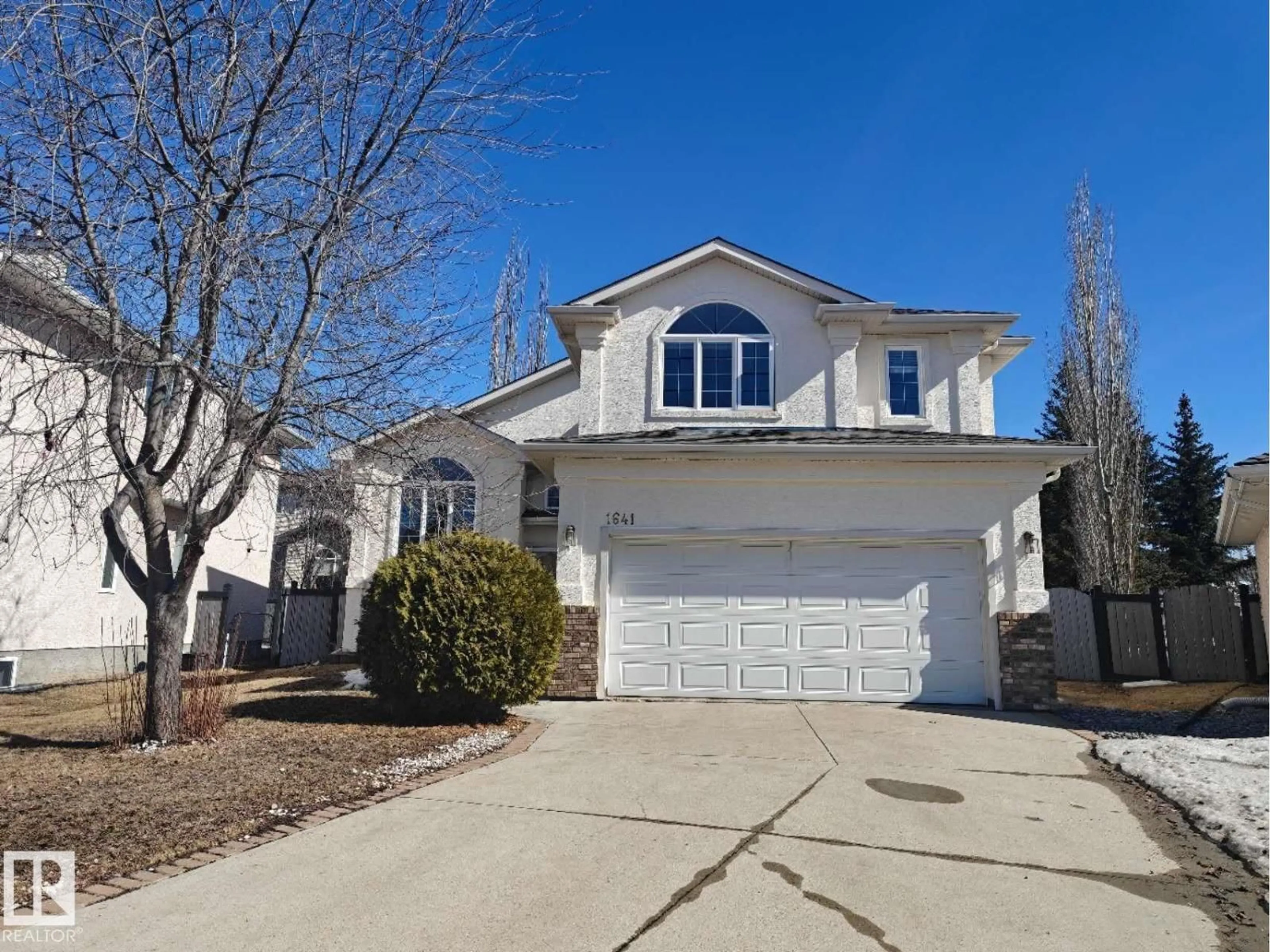 Home with vinyl exterior material, street for 1641 FORBES WY, Edmonton Alberta T6R2R9