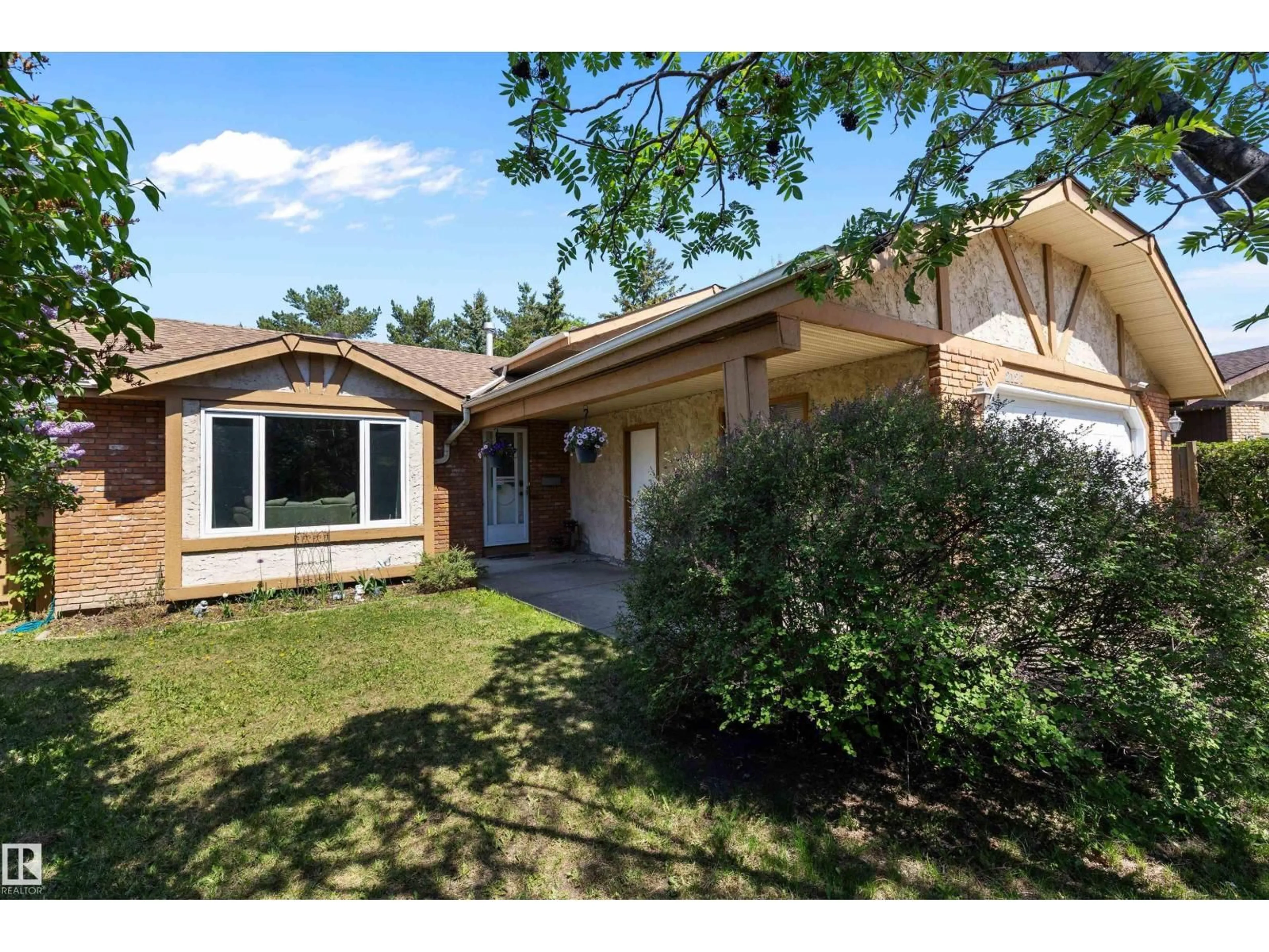 Home with vinyl exterior material, street for NW - 2127 40 ST, Edmonton Alberta T6L4E9