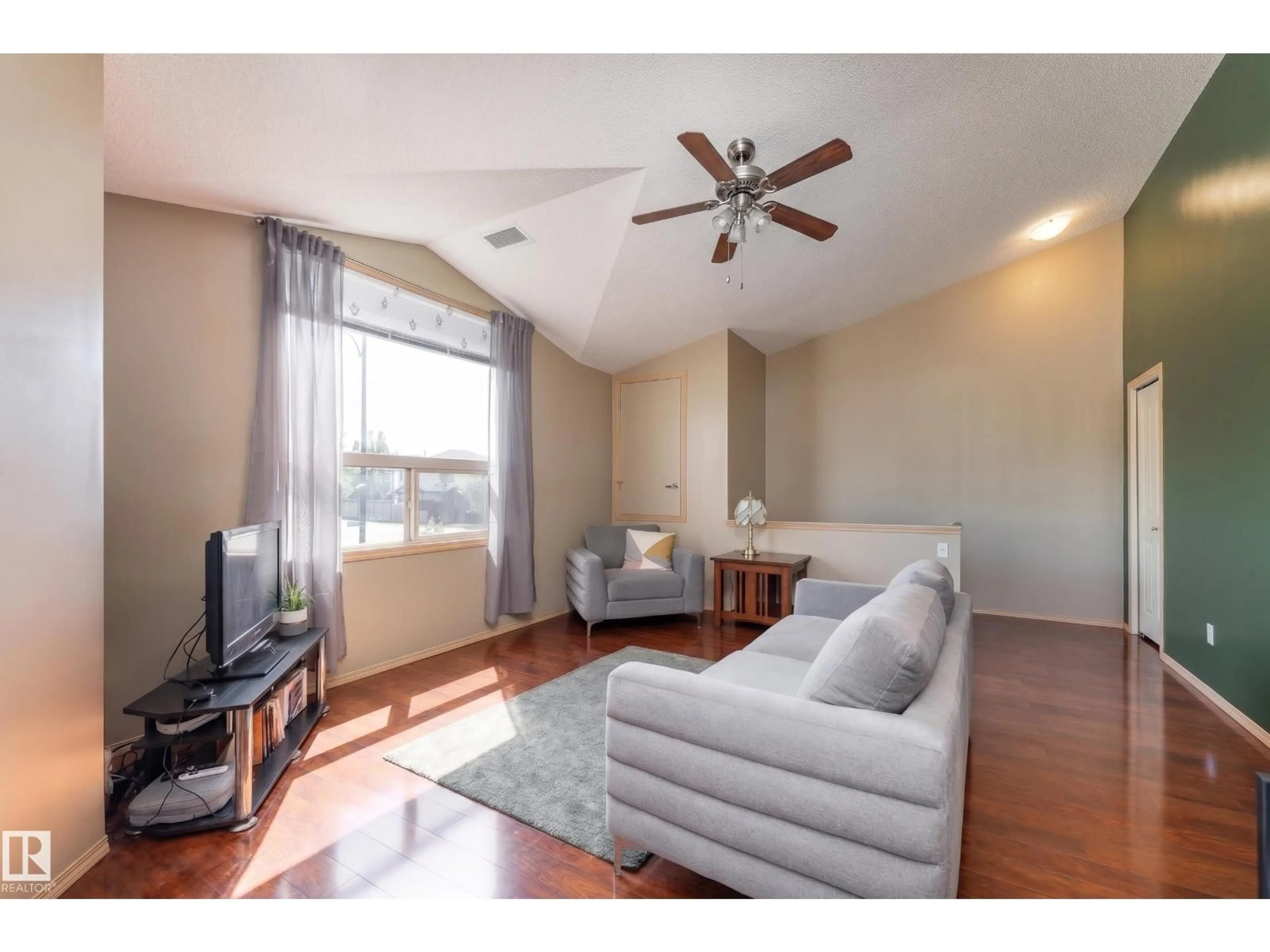 Living room with furniture, wood/laminate floor for 2 - 604 62 ST, Edmonton Alberta T6X0K4