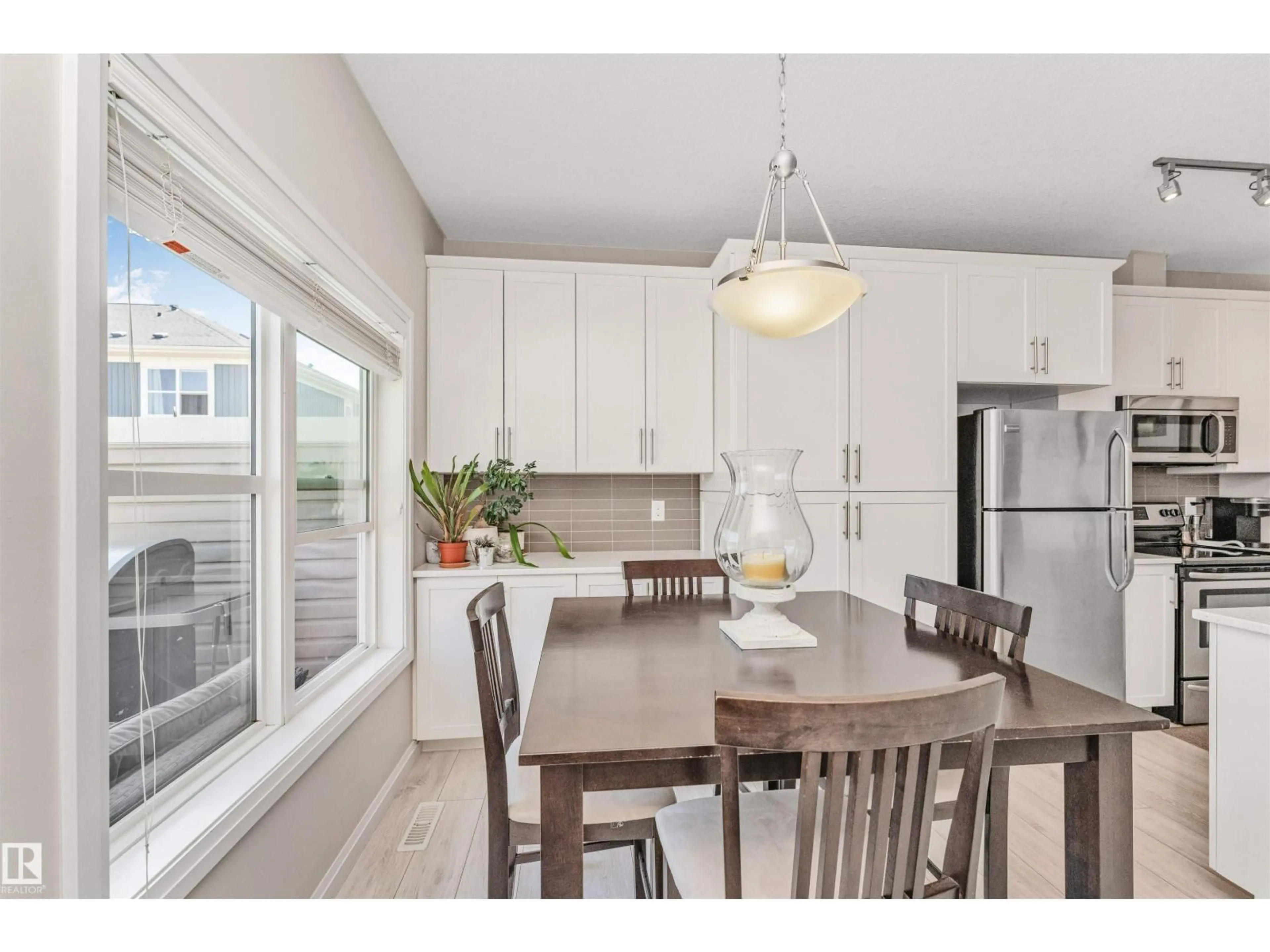 Open concept kitchen, wood/laminate floor for 43 - 3710 ALLAN DR, Edmonton Alberta T6W2C4