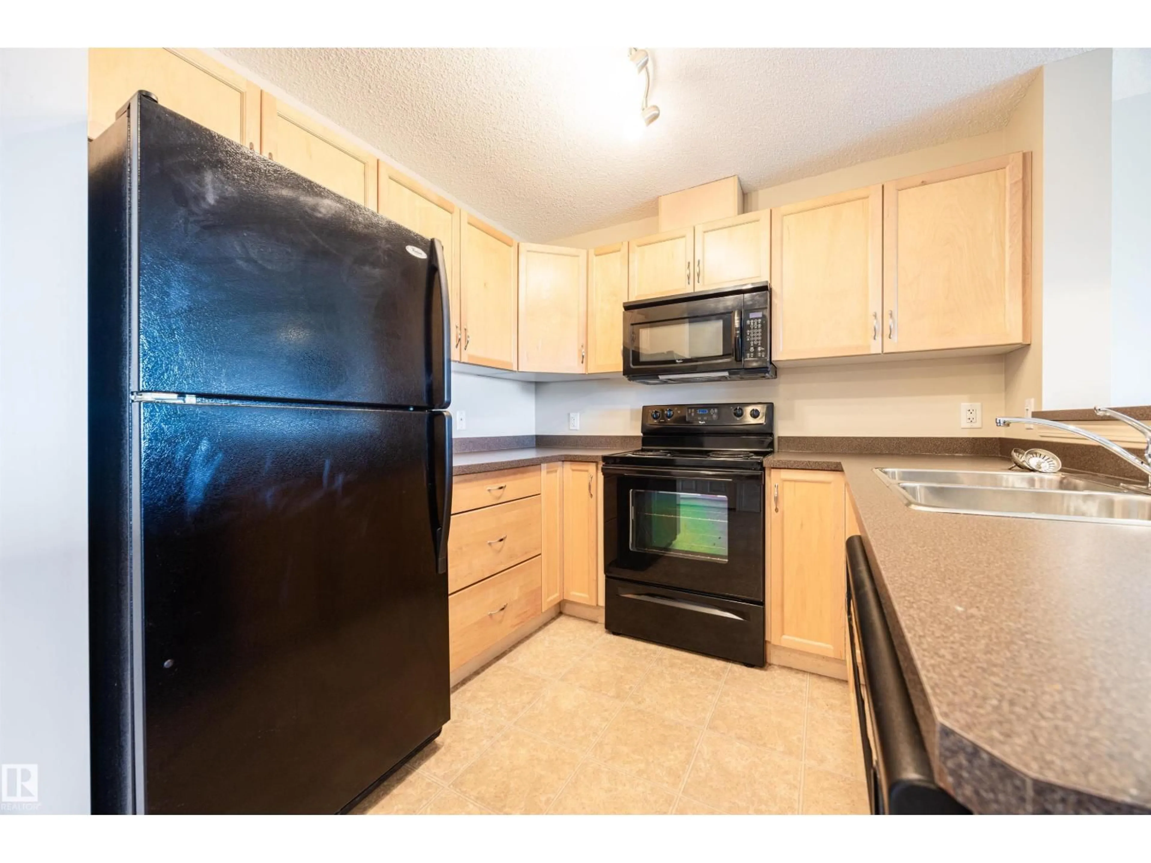 Standard kitchen, unknown for #404 - 5951 165 AV, Edmonton Alberta T5Y0J6