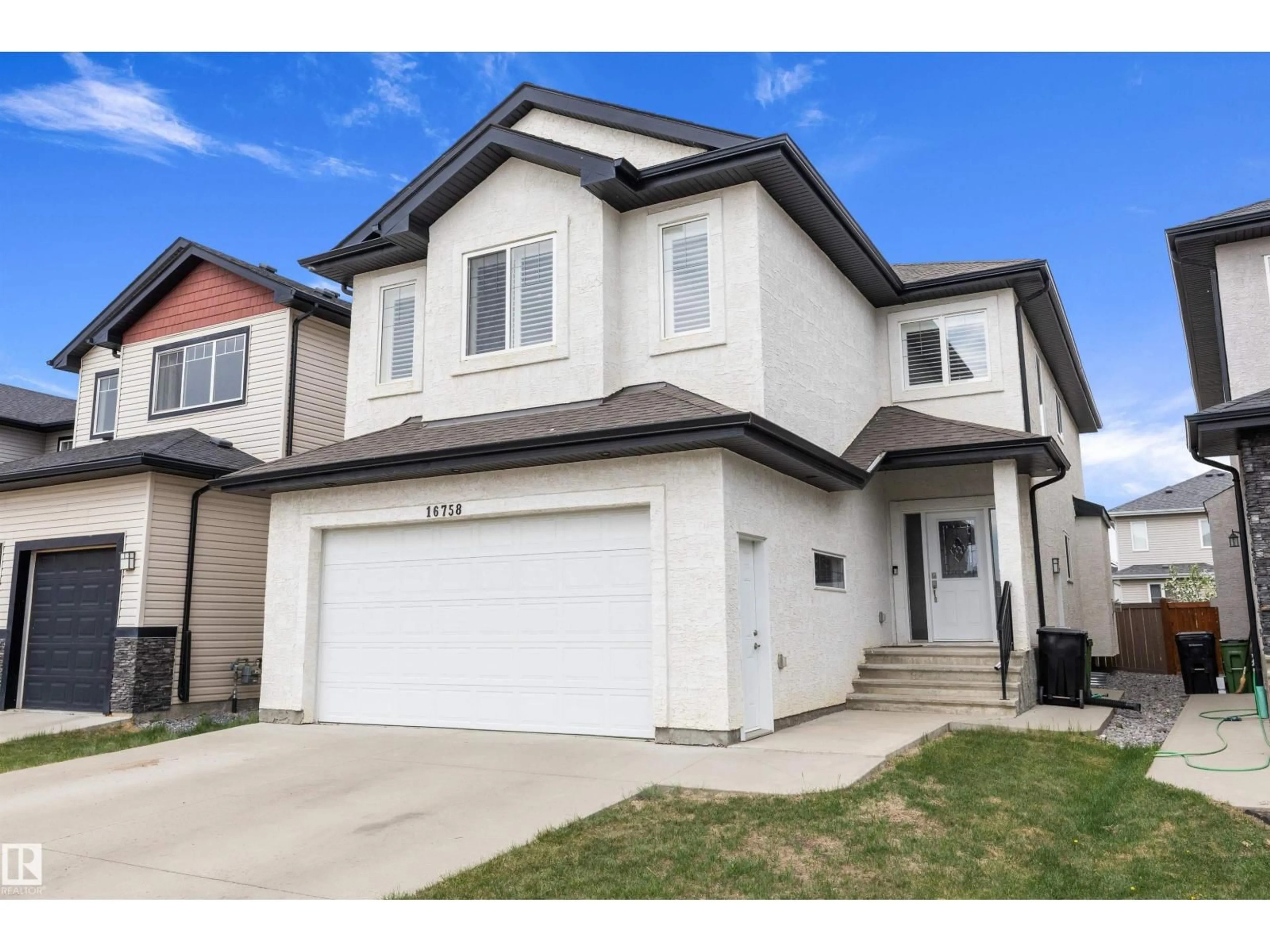 Home with vinyl exterior material, street for NW - 16758 62 ST, Edmonton Alberta T5Y0Z7