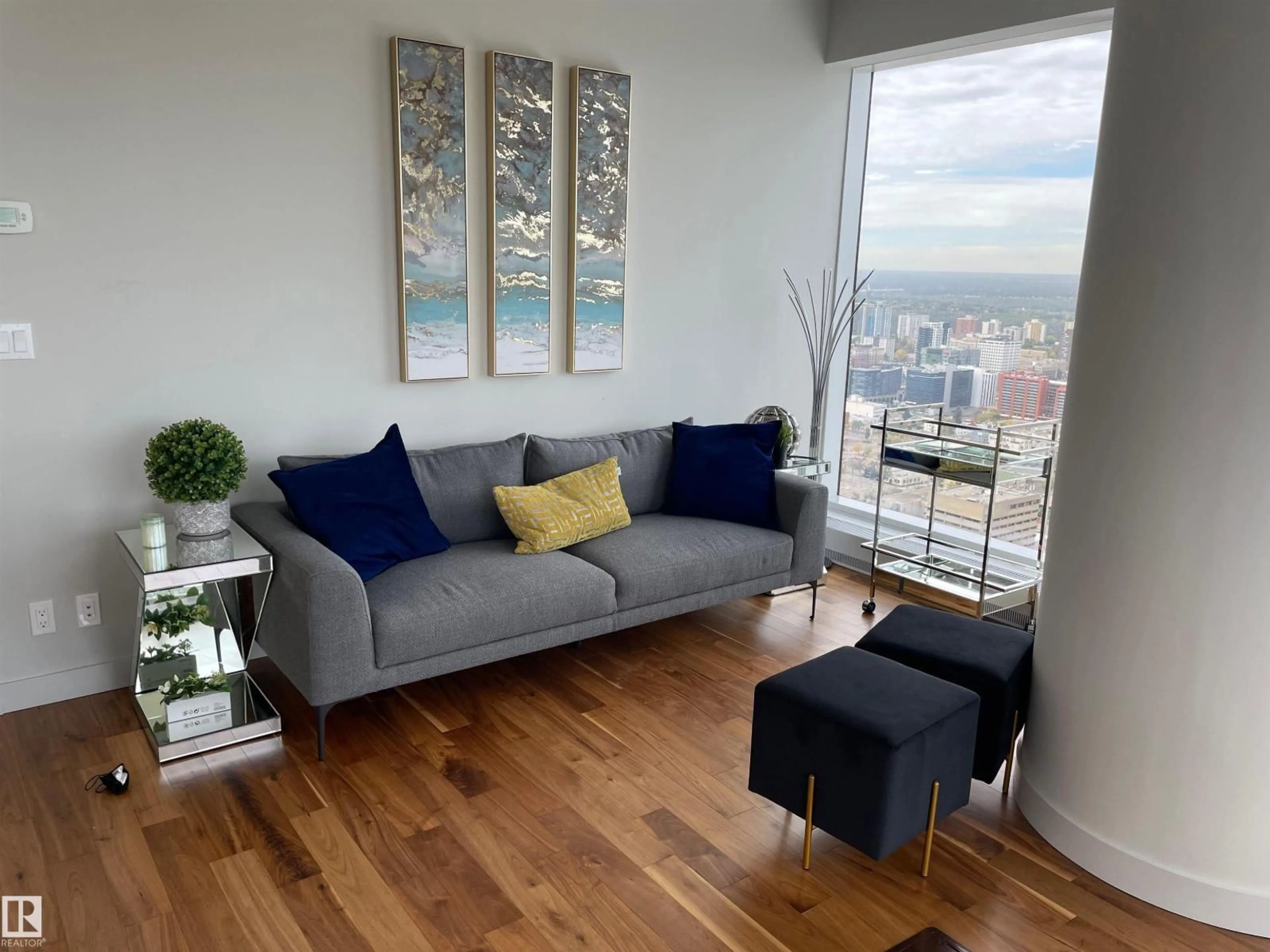 Living room with furniture, wood/laminate floor for 10360 - 3701 102 ST NW, Edmonton Alberta T5J0K6