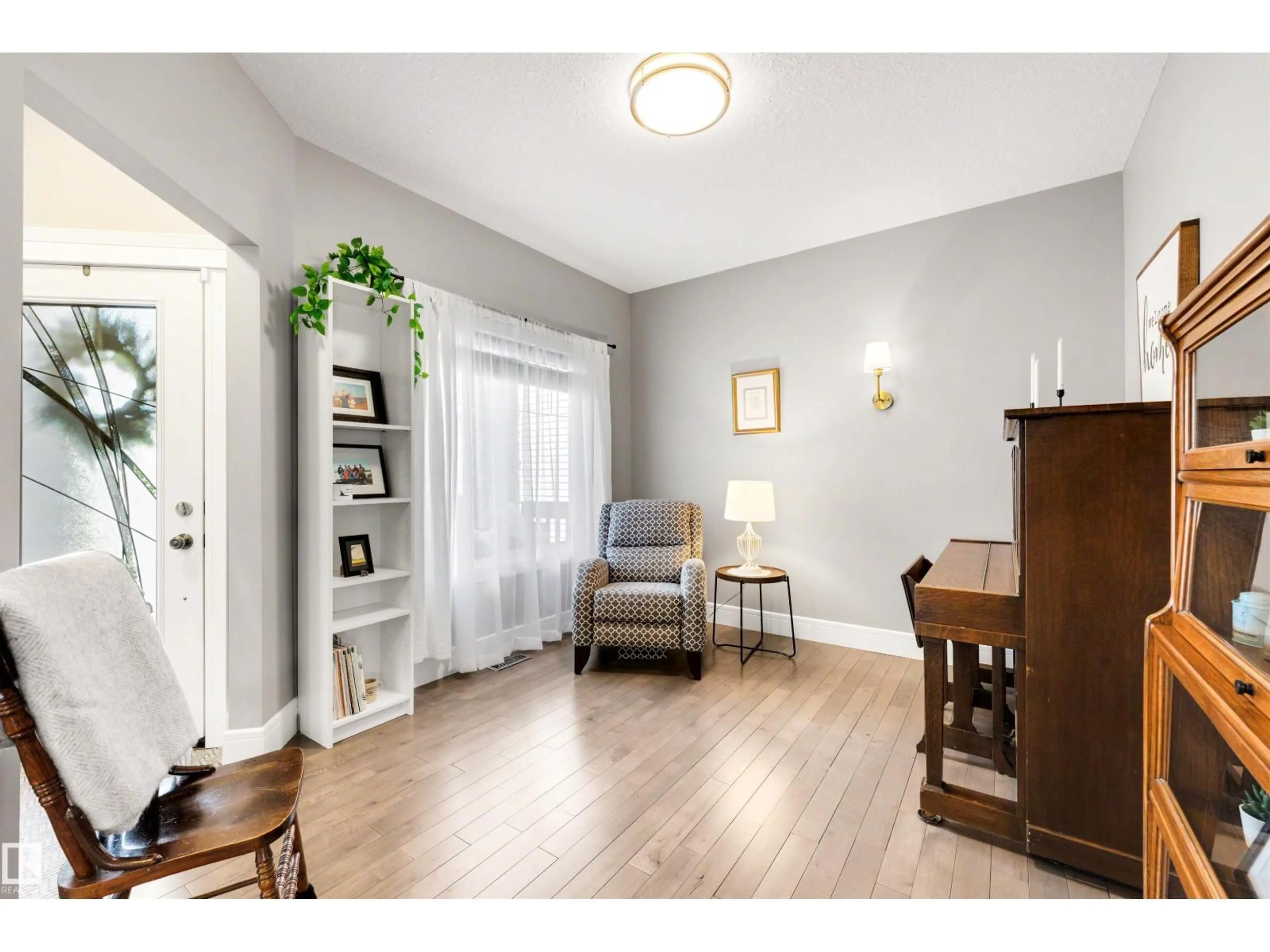 Living room with furniture, wood/laminate floor for 10107 93 ST, Morinville Alberta T8R0C4