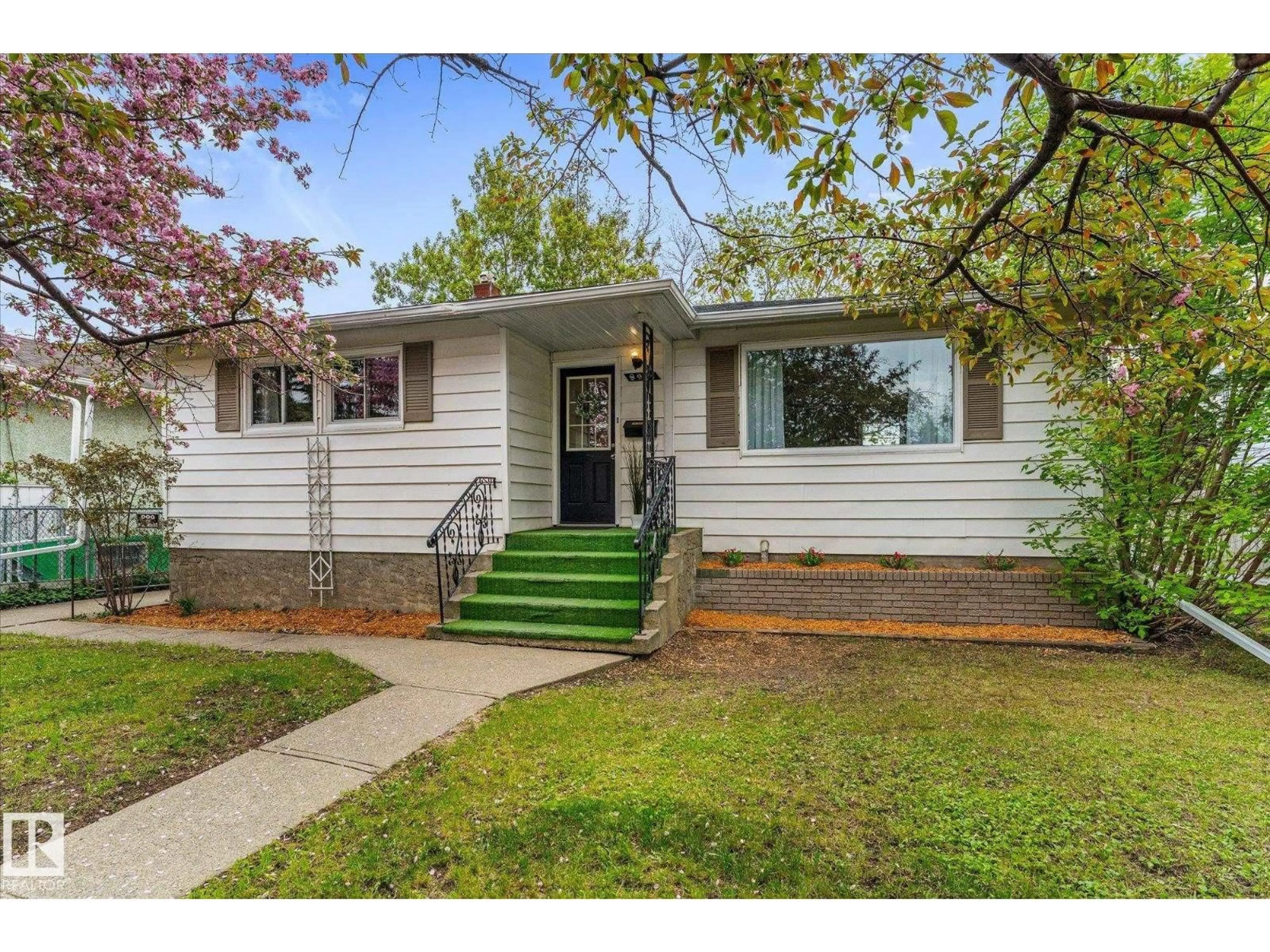 Home with vinyl exterior material, street for 8911 149 ST, Edmonton Alberta T5R1B7