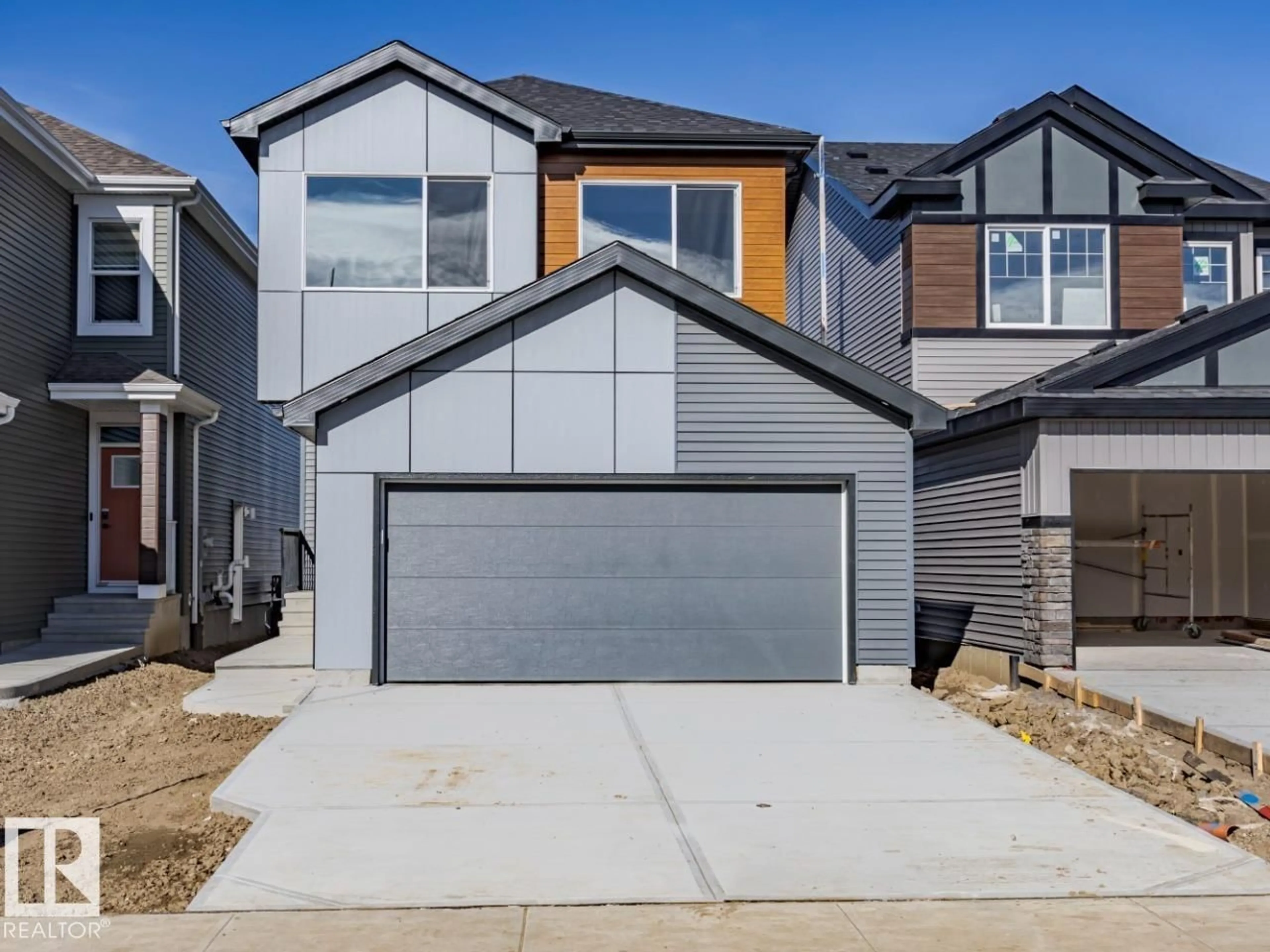 Home with vinyl exterior material, street for 7387 KLAPSTEIN CR, Edmonton Alberta T6W0A6