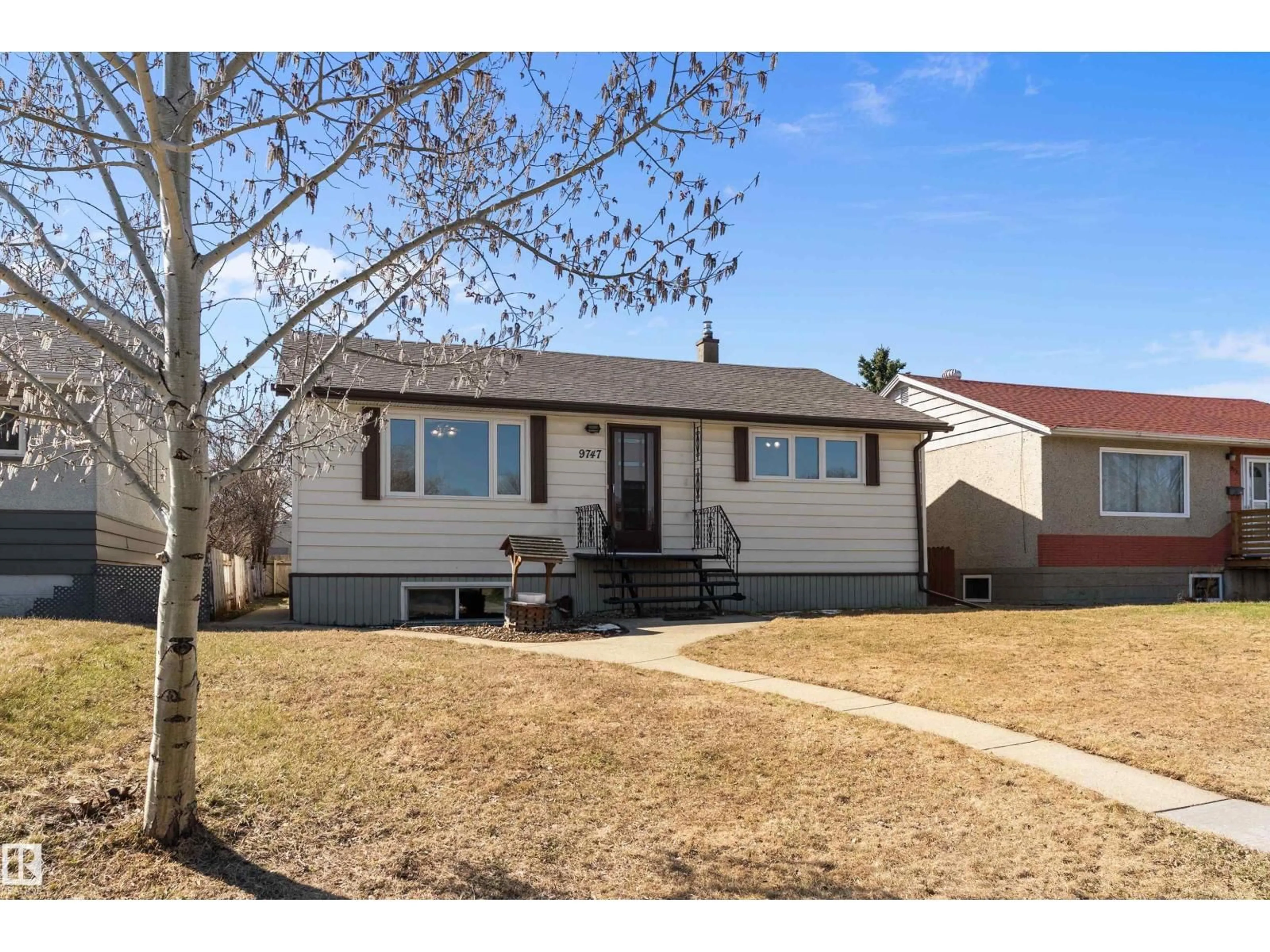 Home with vinyl exterior material, street for 9747 66 AV, Edmonton Alberta T6E0M4