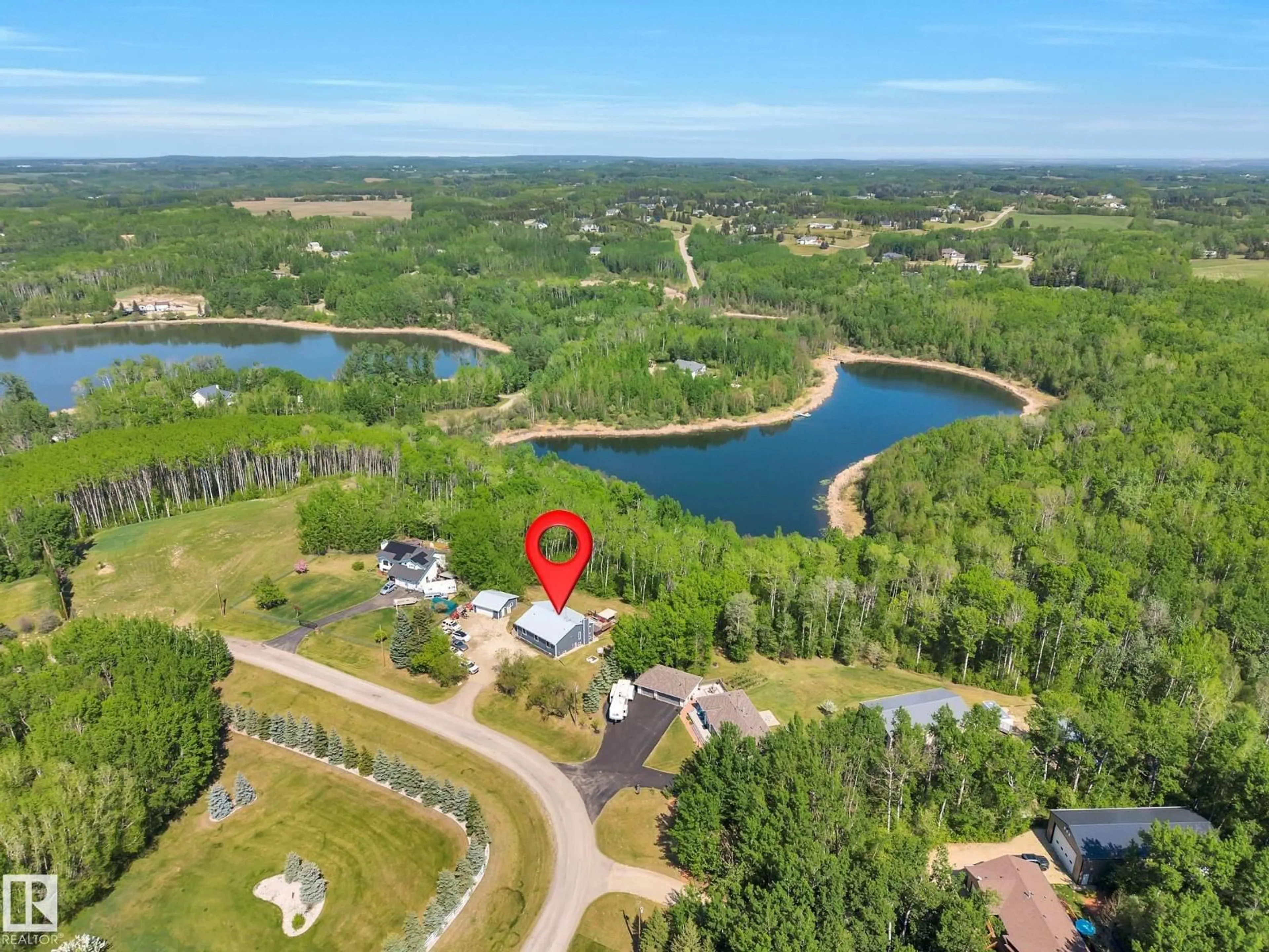 A pic from outside/outdoor area/front of a property/back of a property/a pic from drone, water/lake/river/ocean view for 86 53303 RGE ROAD 20, Rural Parkland County Alberta T7Y0C4