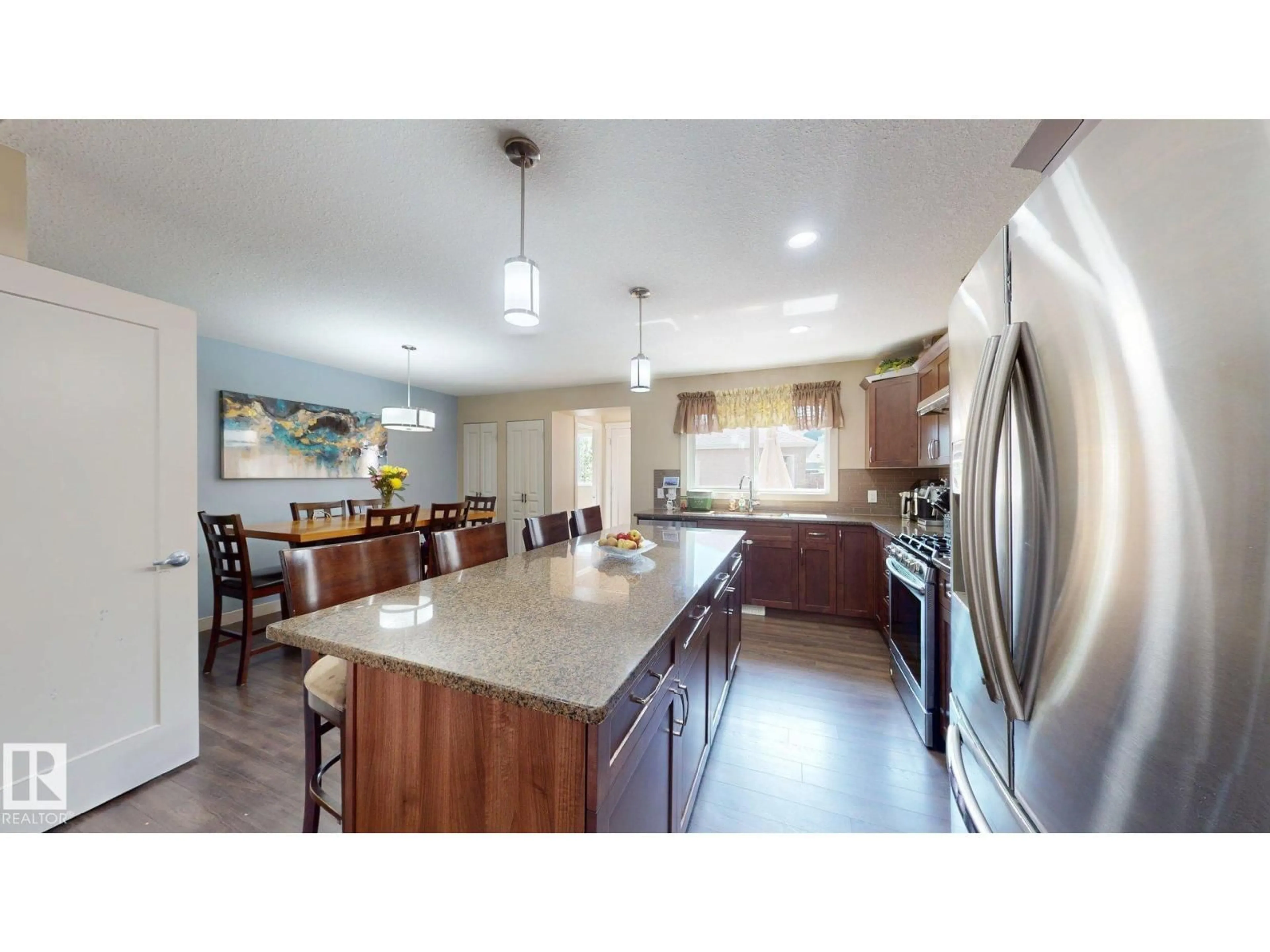 Open concept kitchen, ceramic/tile floor for 6824 EVANS WD, Edmonton Alberta T6M0T3