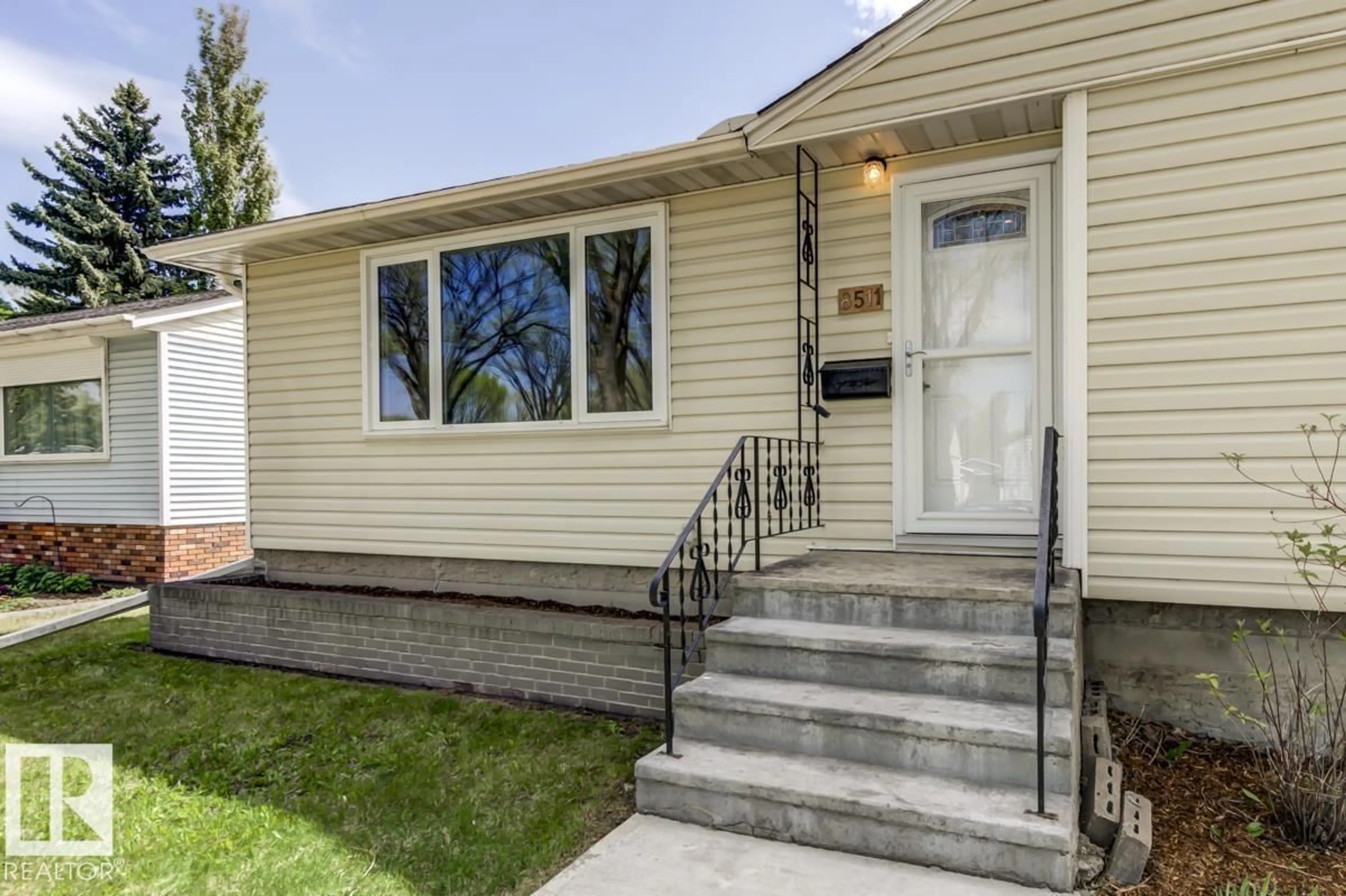 Home with vinyl exterior material, street for 8511 64 AV, Edmonton Alberta T6E0H1