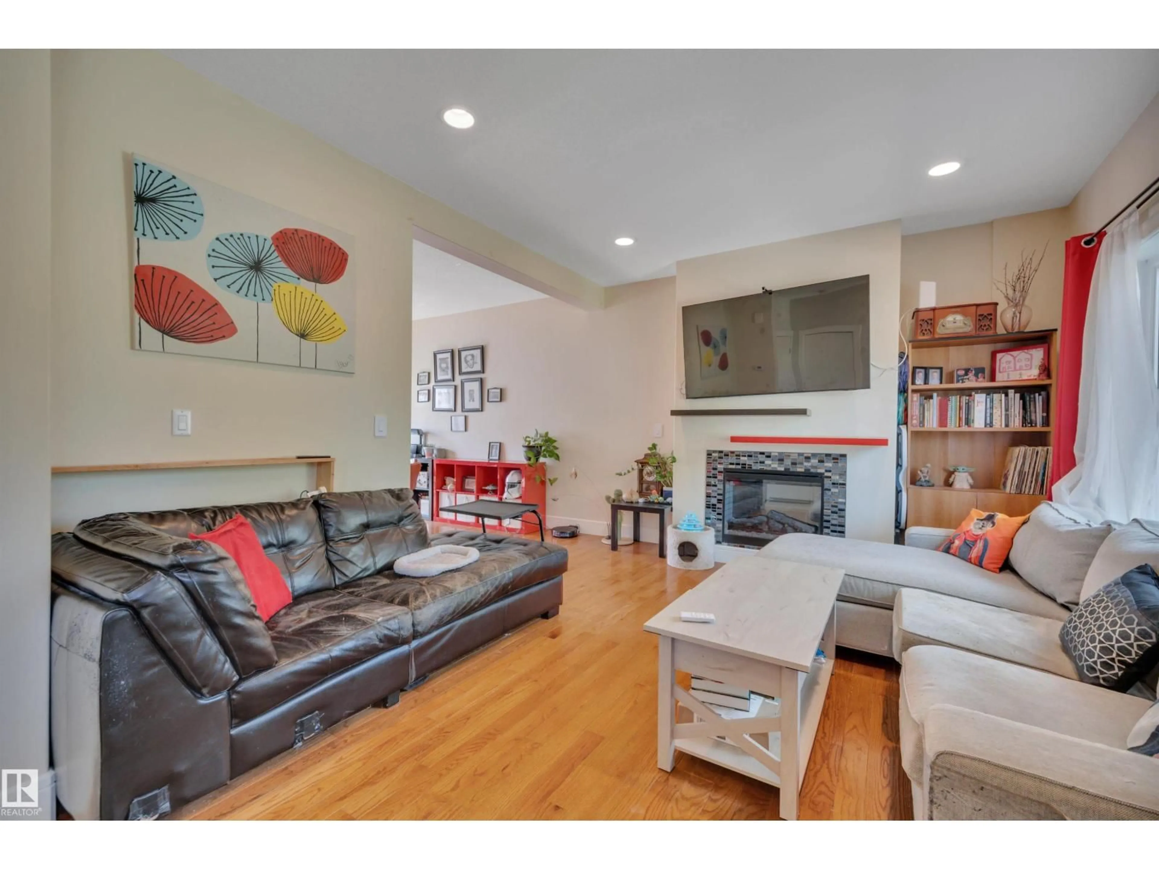 Living room with furniture, unknown for 12205 112 AV, Edmonton Alberta T5M0B4