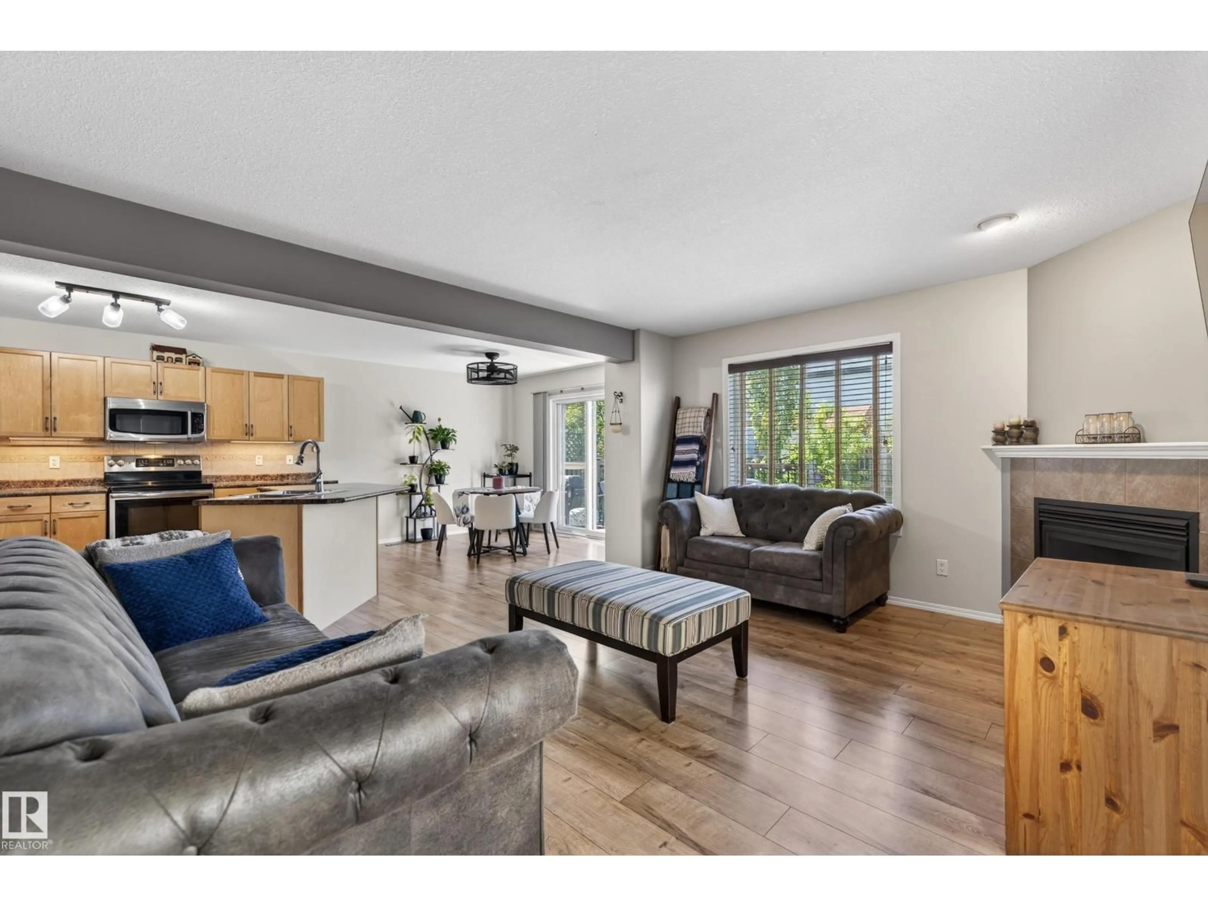 Living room with furniture, wood/laminate floor for 988 REGENCY DR, Sherwood Park Alberta T8A2H4