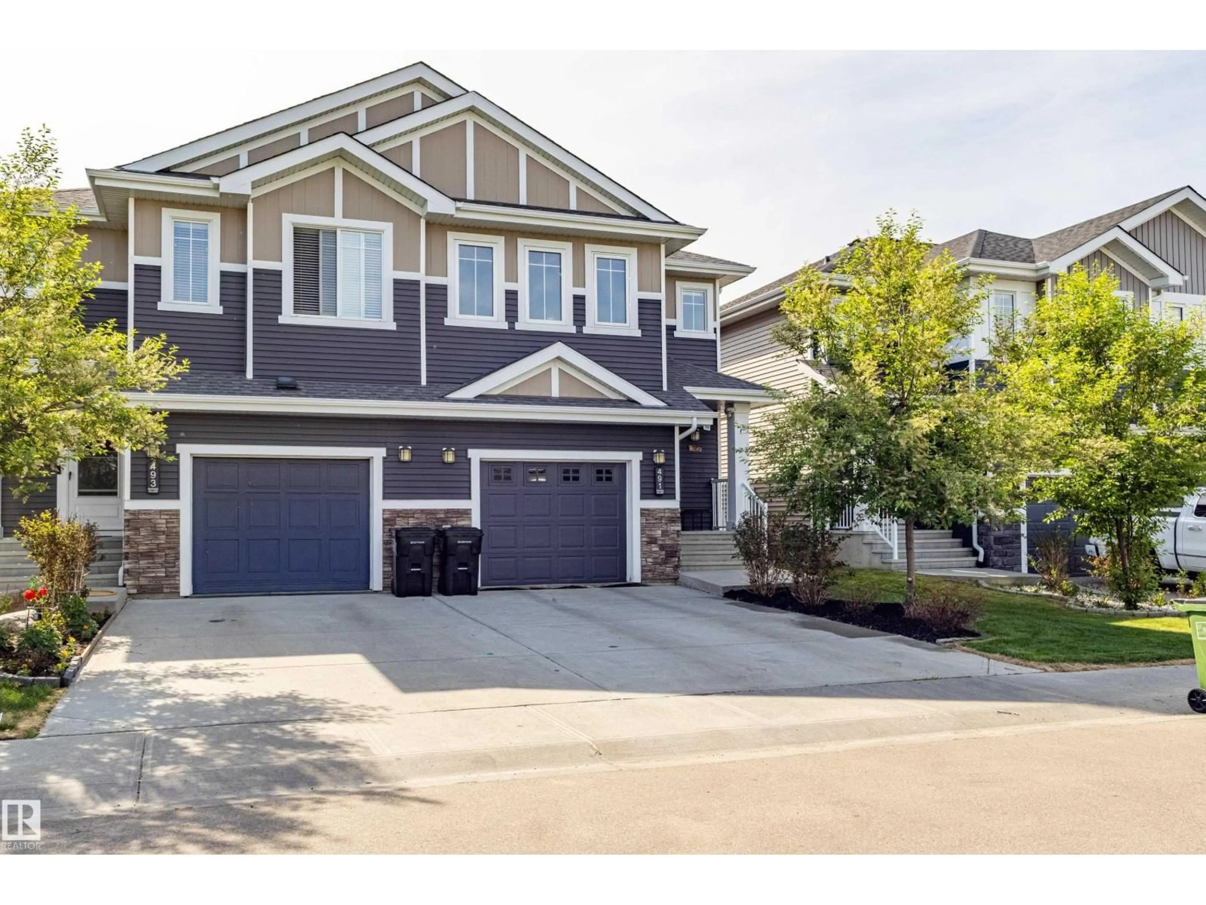 Home with vinyl exterior material, street for 491 EBBERS WY, Edmonton Alberta T5Y3T7