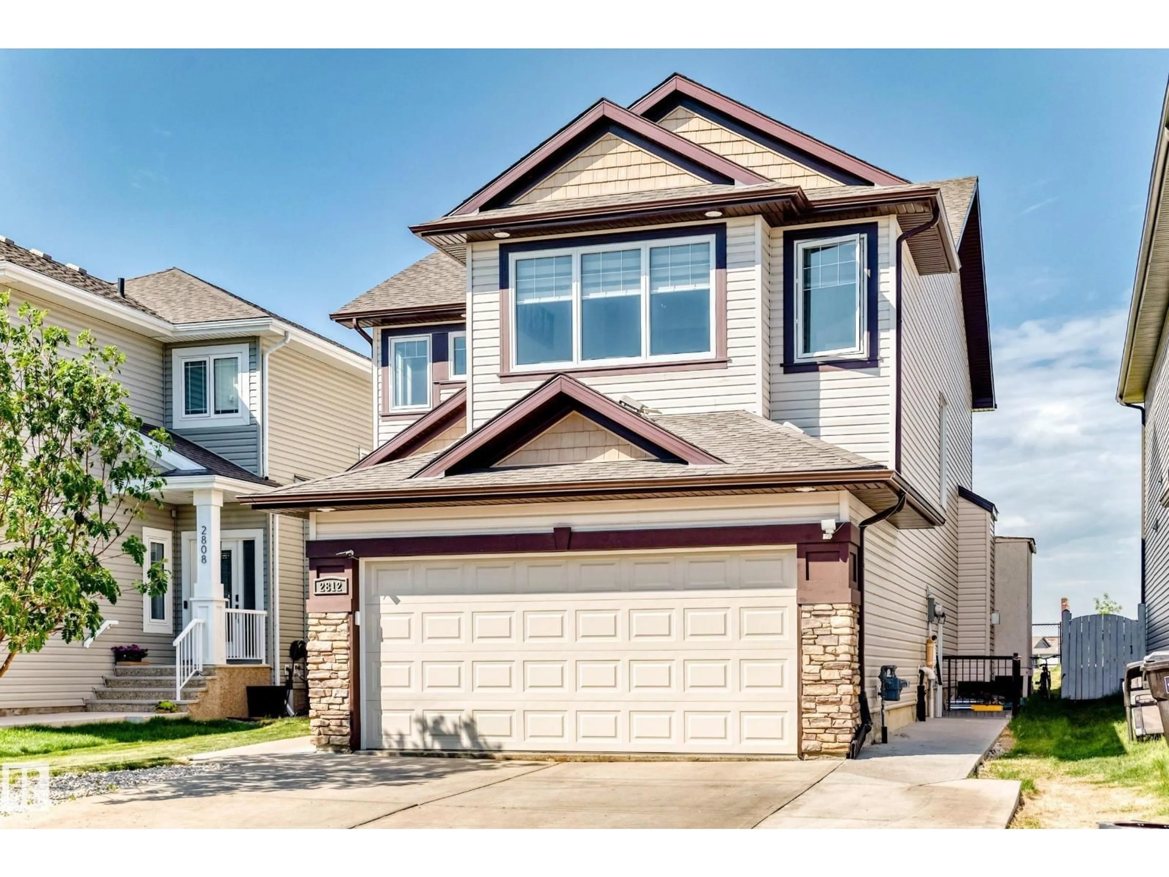 Home with vinyl exterior material, street for 2812 12 ST, Edmonton Alberta T6T0V8