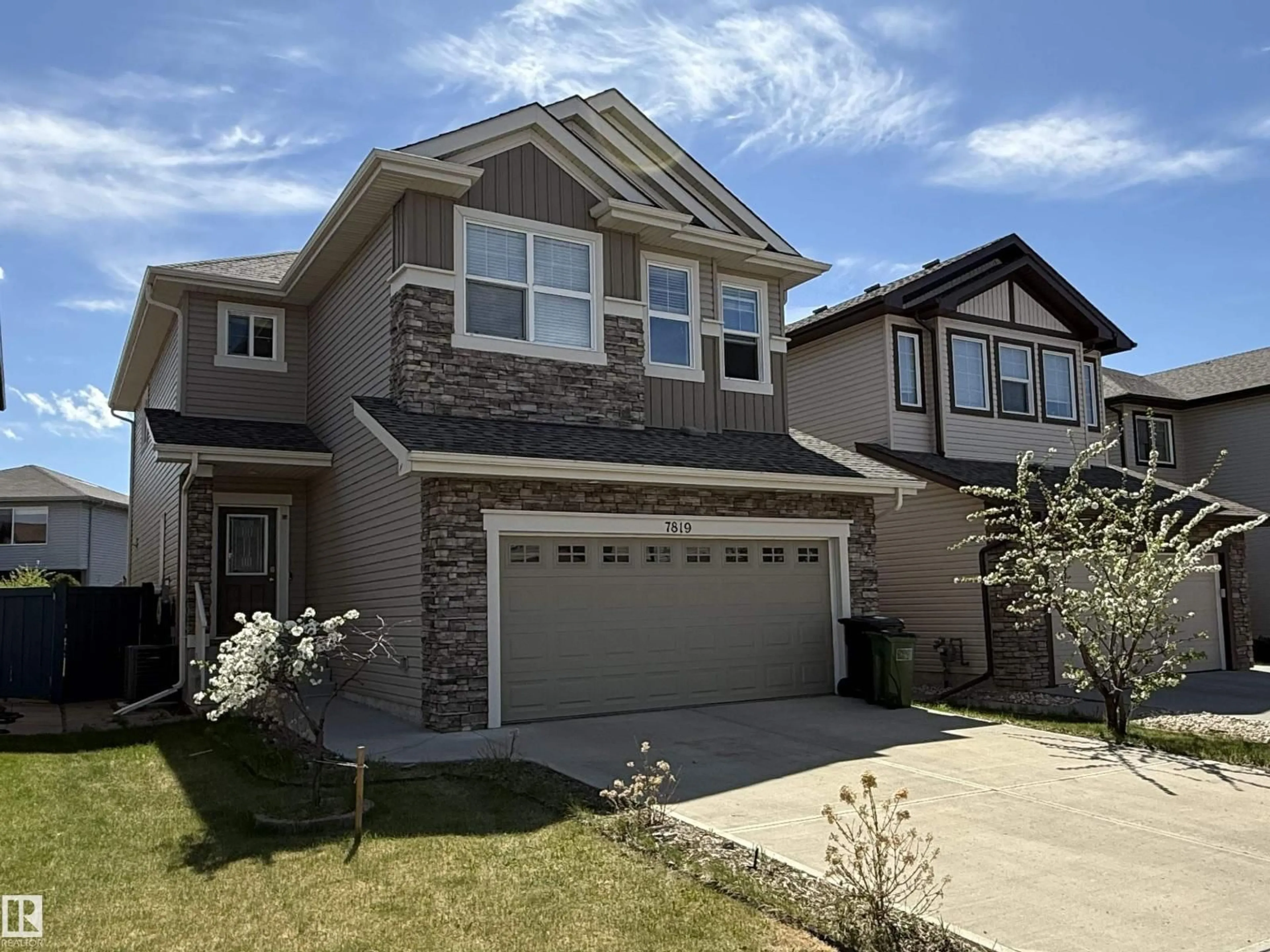 Home with vinyl exterior material, street for NW - 7819 173 AV, Edmonton Alberta T5Z0H6