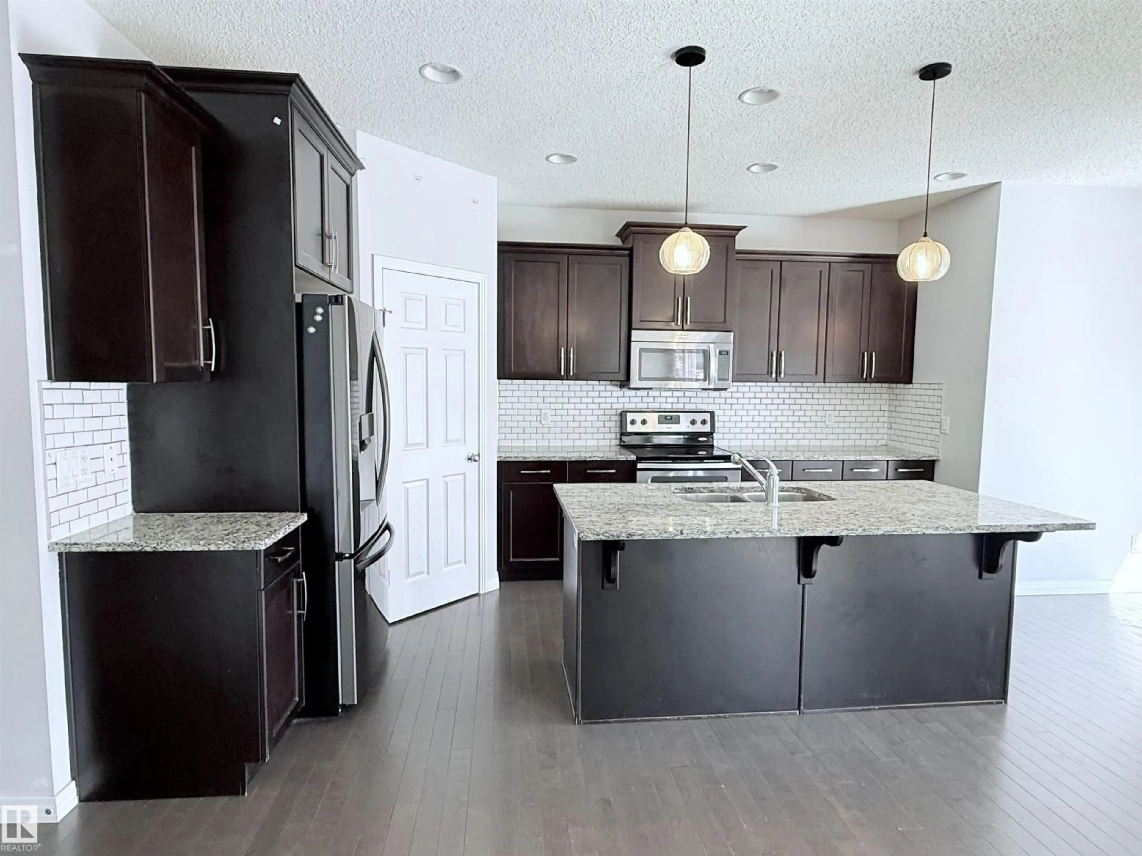 Open concept kitchen, unknown for NW - 7819 173 AV, Edmonton Alberta T5Z0H6
