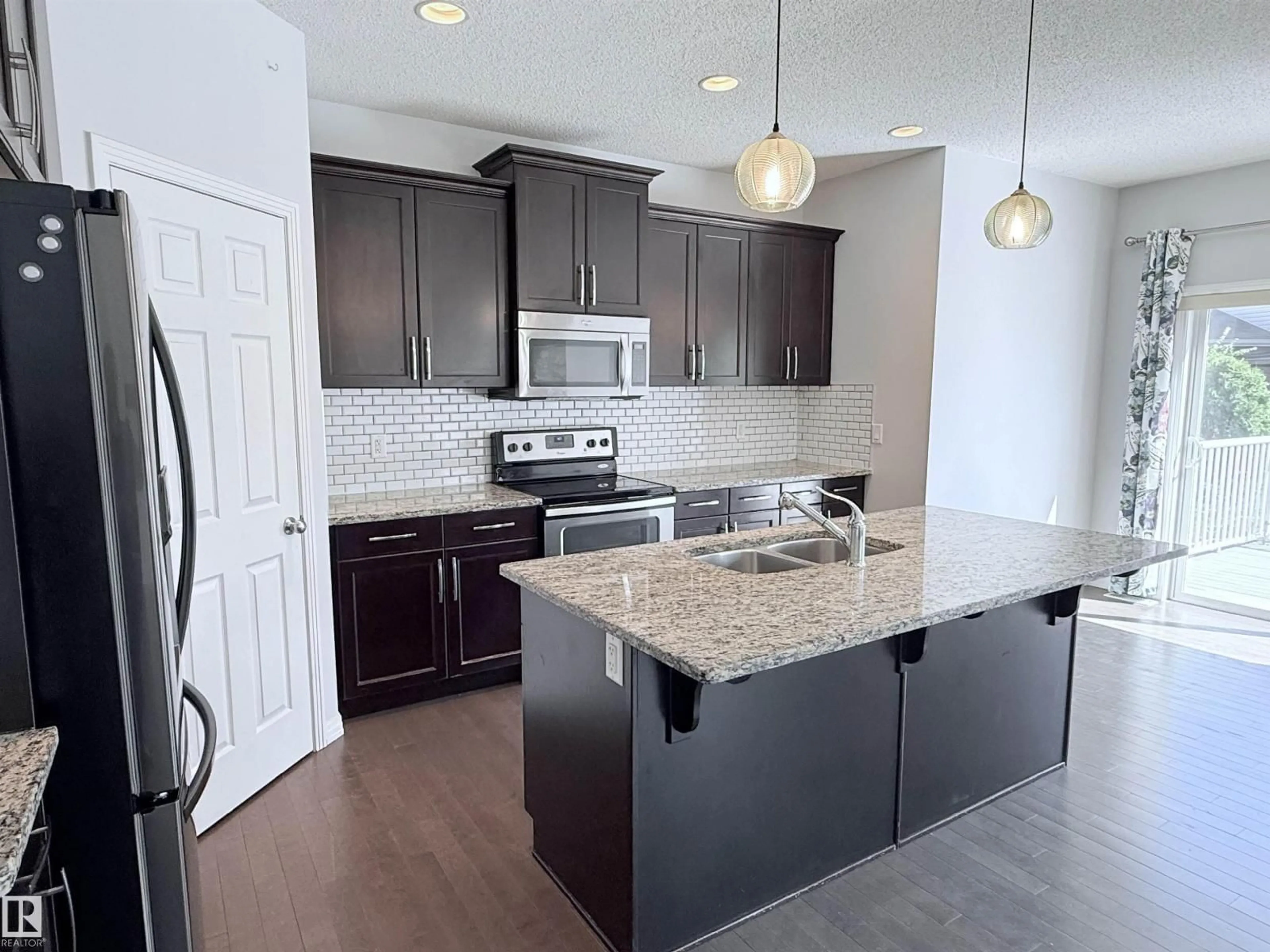 Open concept kitchen, ceramic/tile floor for NW - 7819 173 AV, Edmonton Alberta T5Z0H6