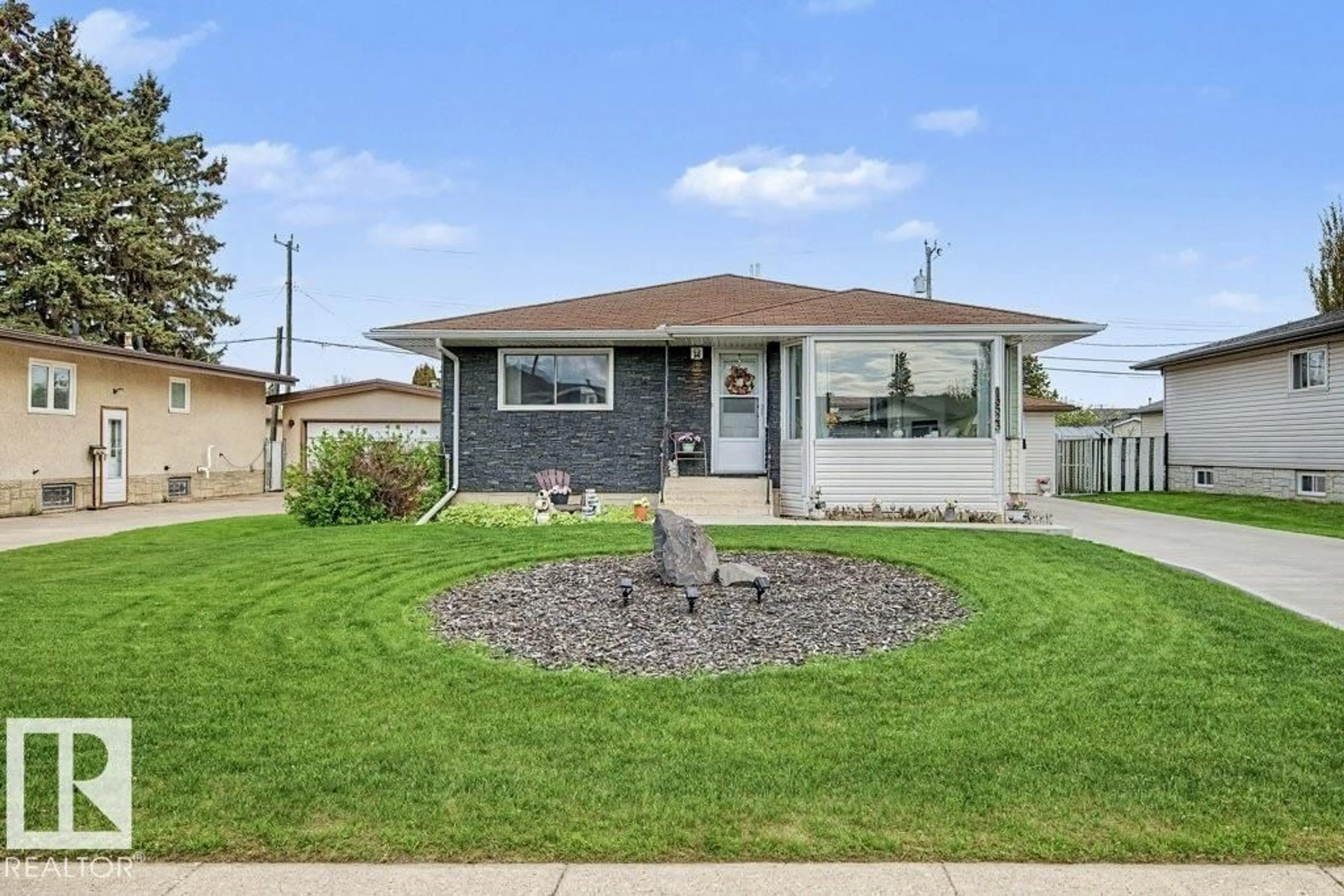Home with vinyl exterior material, street for NW - 13523 65 ST, Edmonton Alberta T5A1A5