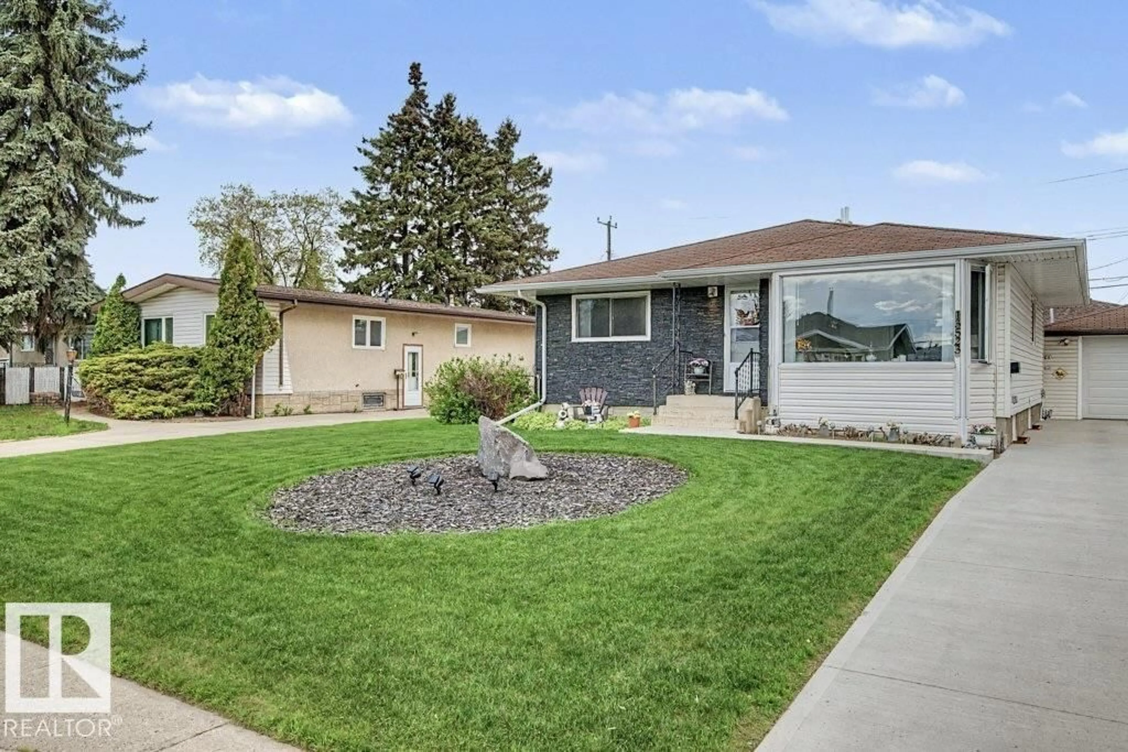 Home with vinyl exterior material, street for NW - 13523 65 ST, Edmonton Alberta T5A1A5