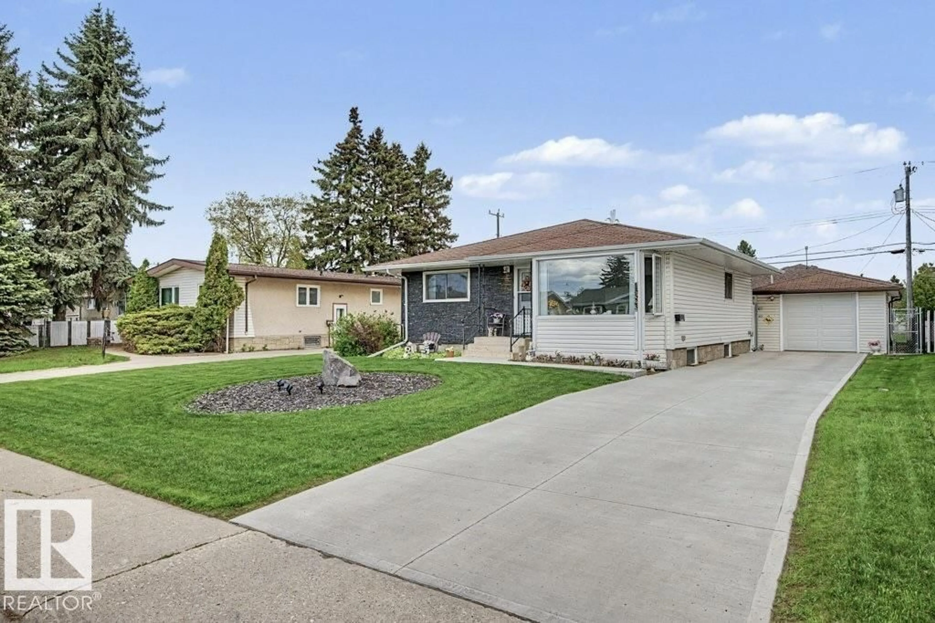 Home with vinyl exterior material, street for NW - 13523 65 ST, Edmonton Alberta T5A1A5
