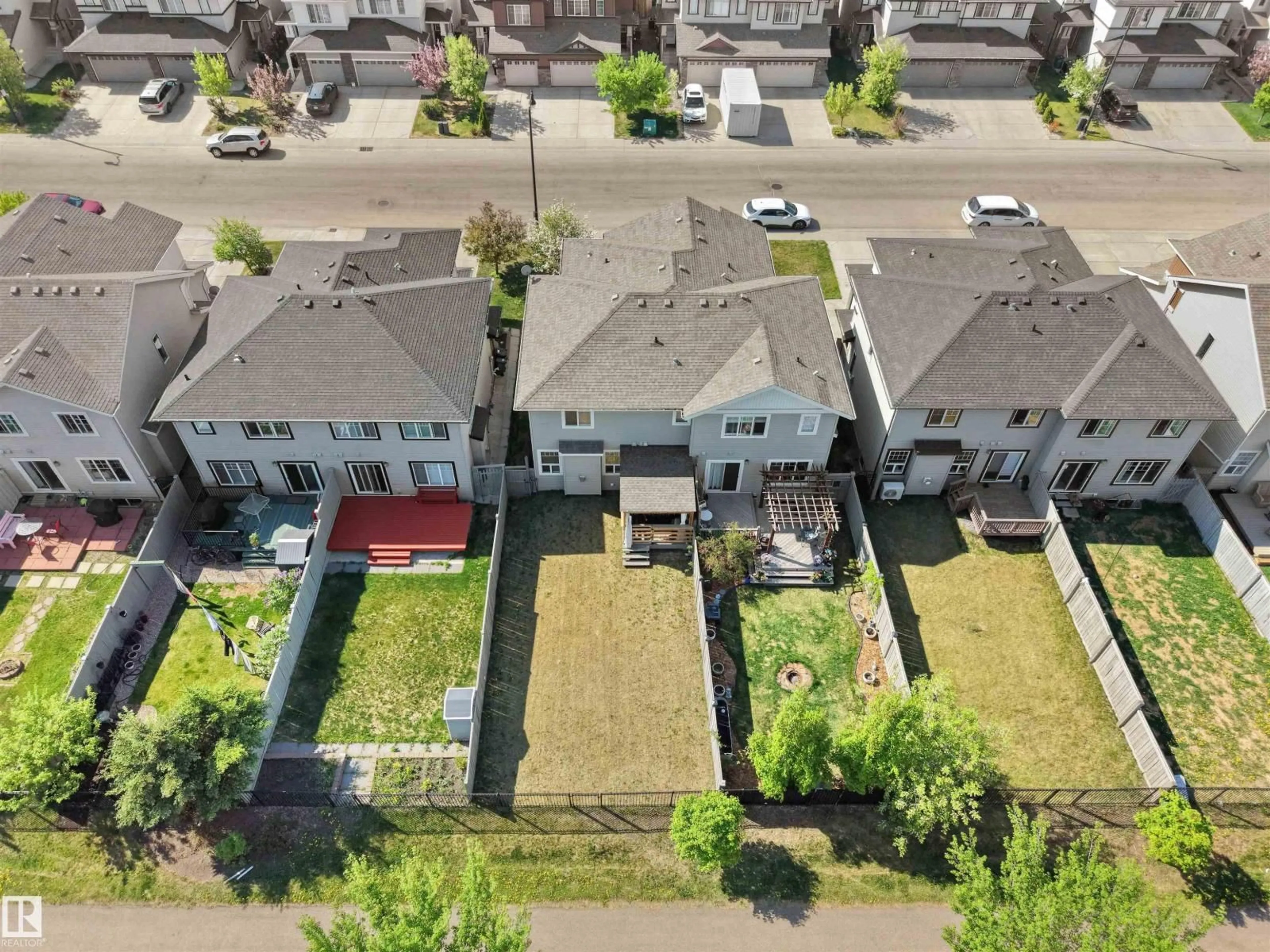A pic from outside/outdoor area/front of a property/back of a property/a pic from drone, street for 1692 CUNNINGHAM WY, Edmonton Alberta T6W0W5
