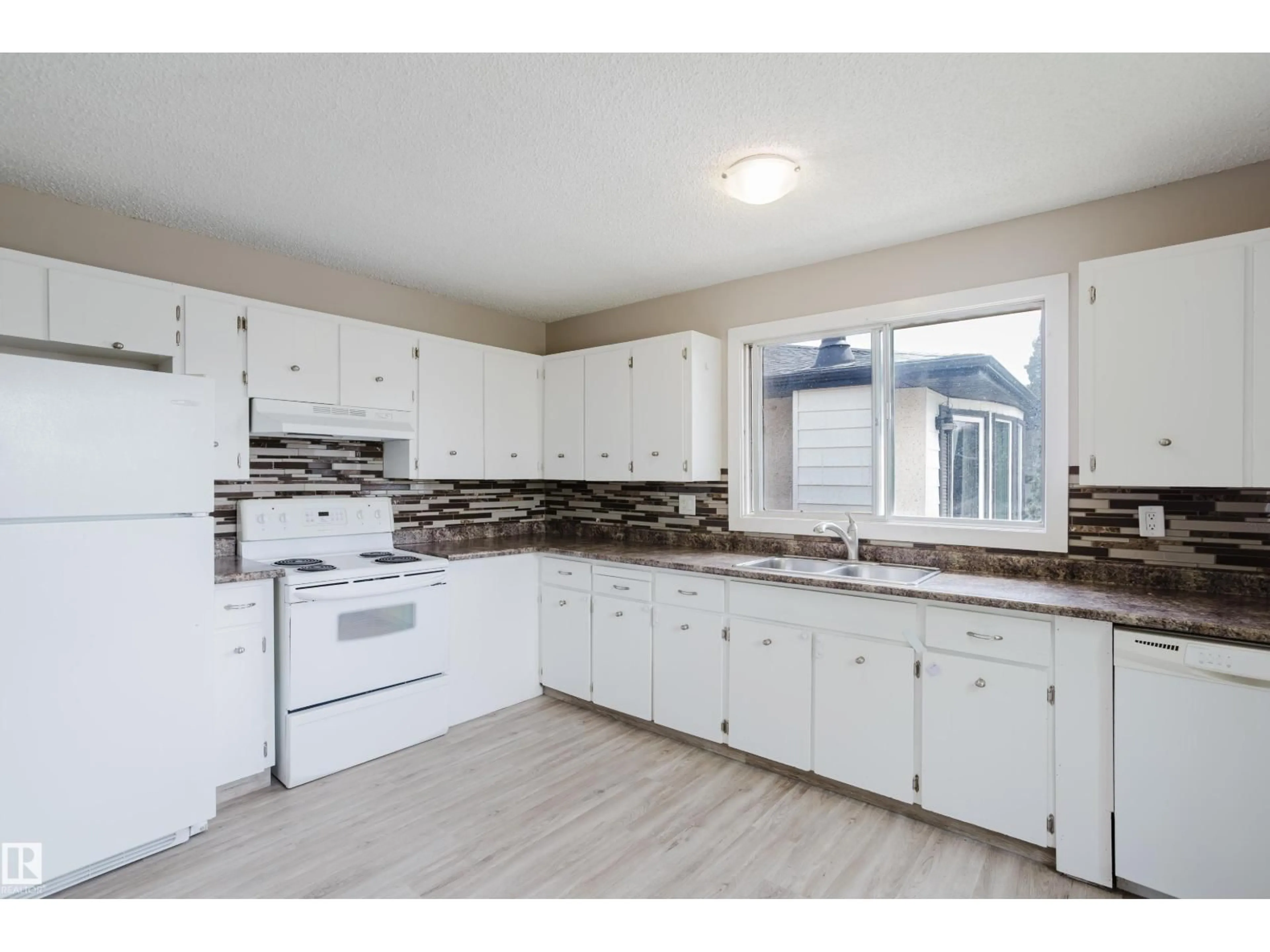 Open concept kitchen, unknown for 11916 152A AV, Edmonton Alberta T5X1E6
