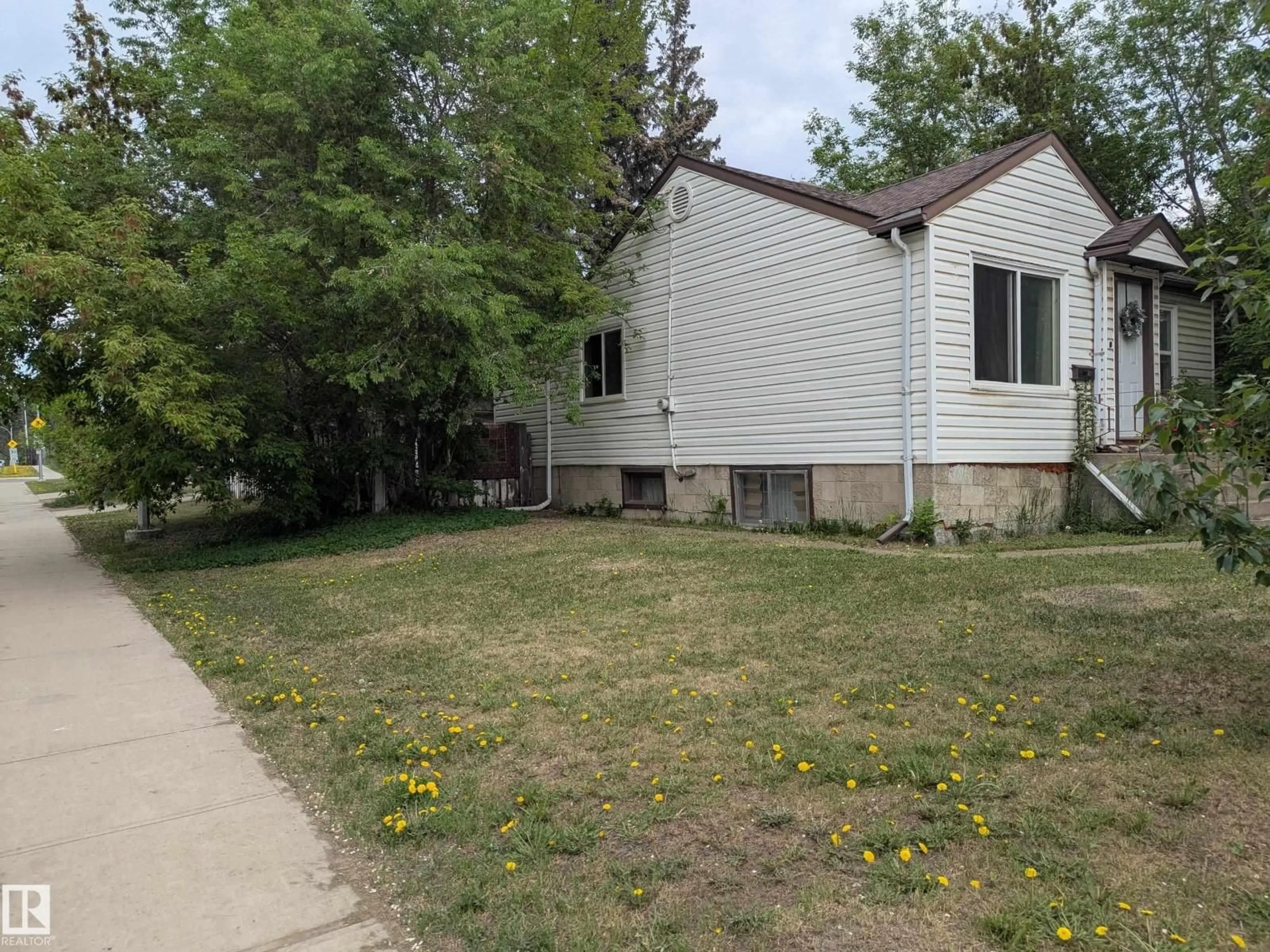 Home with vinyl exterior material, street for 10650 76 AV, Edmonton Alberta T6E1L5