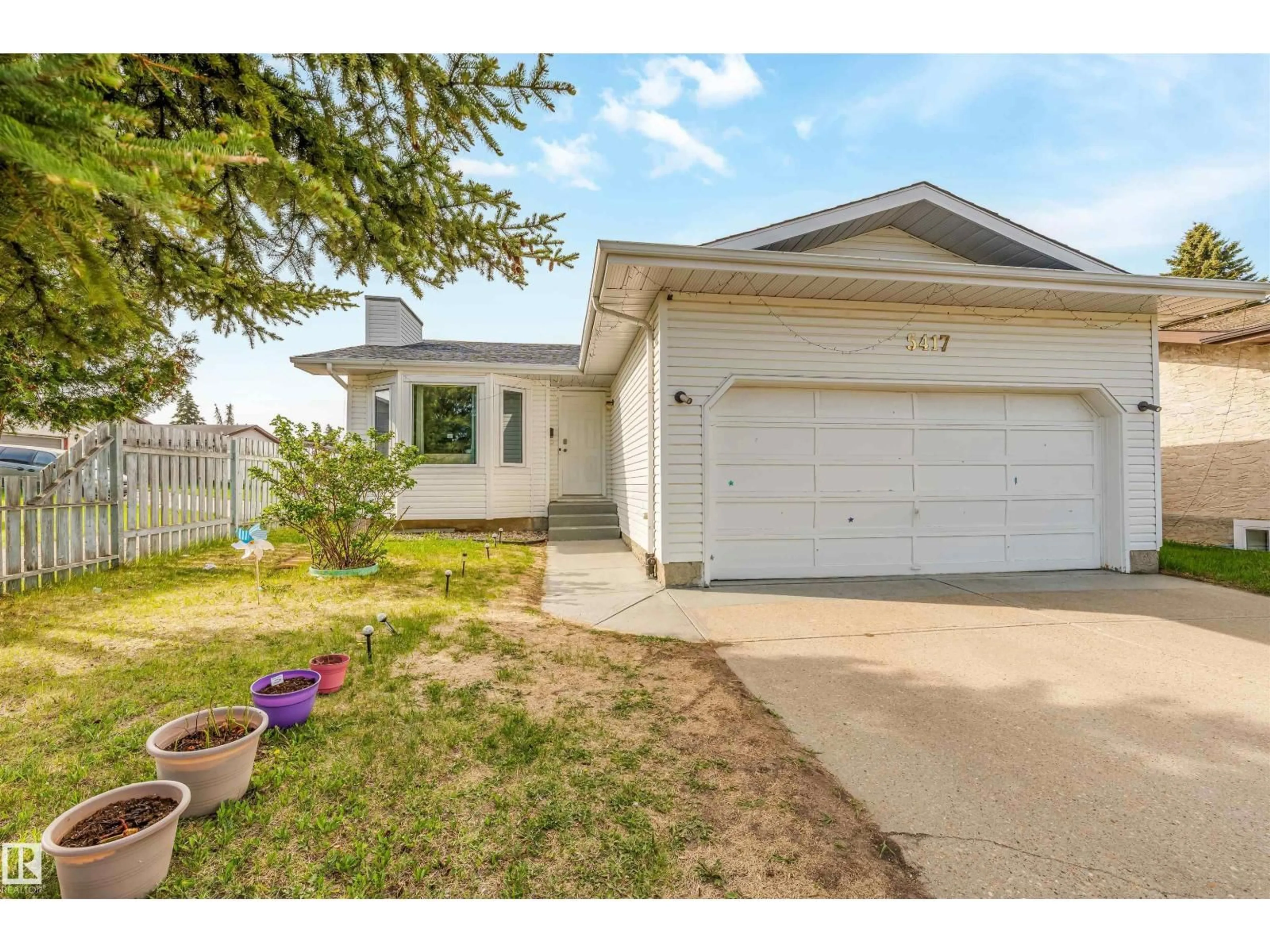 Home with vinyl exterior material, street for 5417 14A AVE, Edmonton Alberta T6L3B6