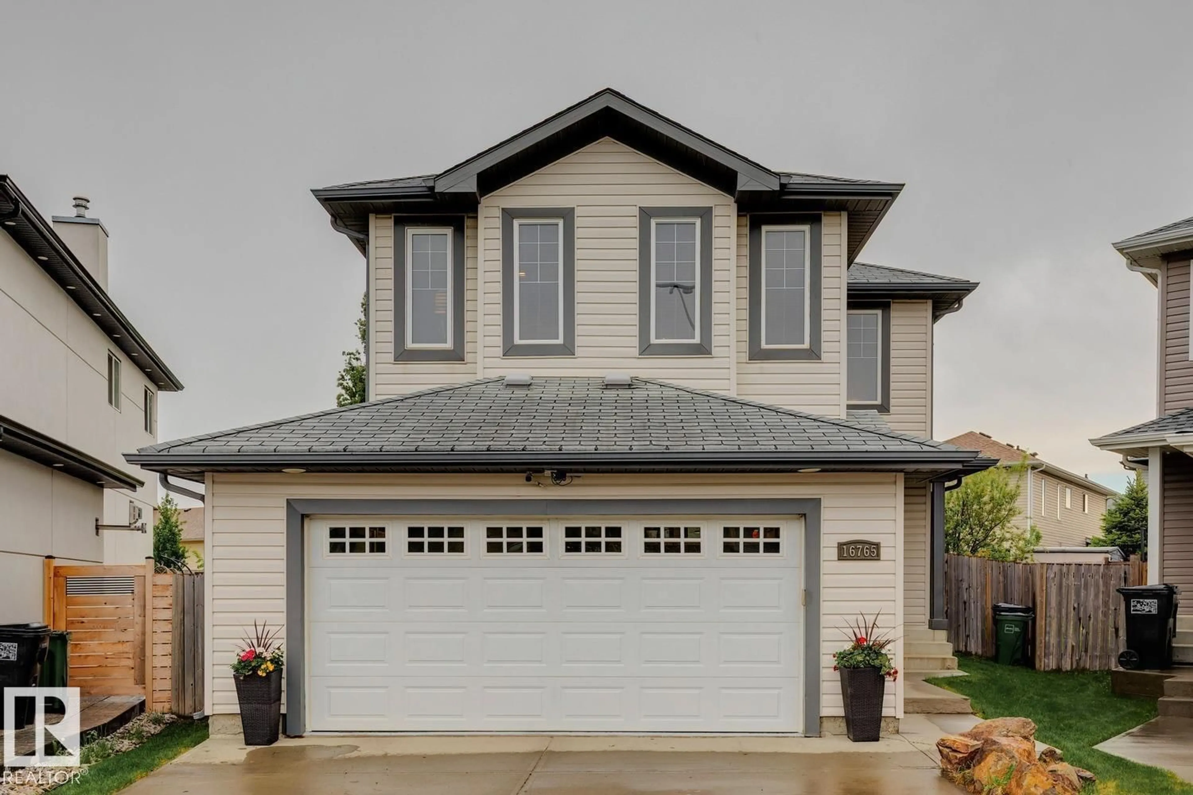 Home with vinyl exterior material, street for 16765 119 ST NW, Edmonton Alberta T5X6K4