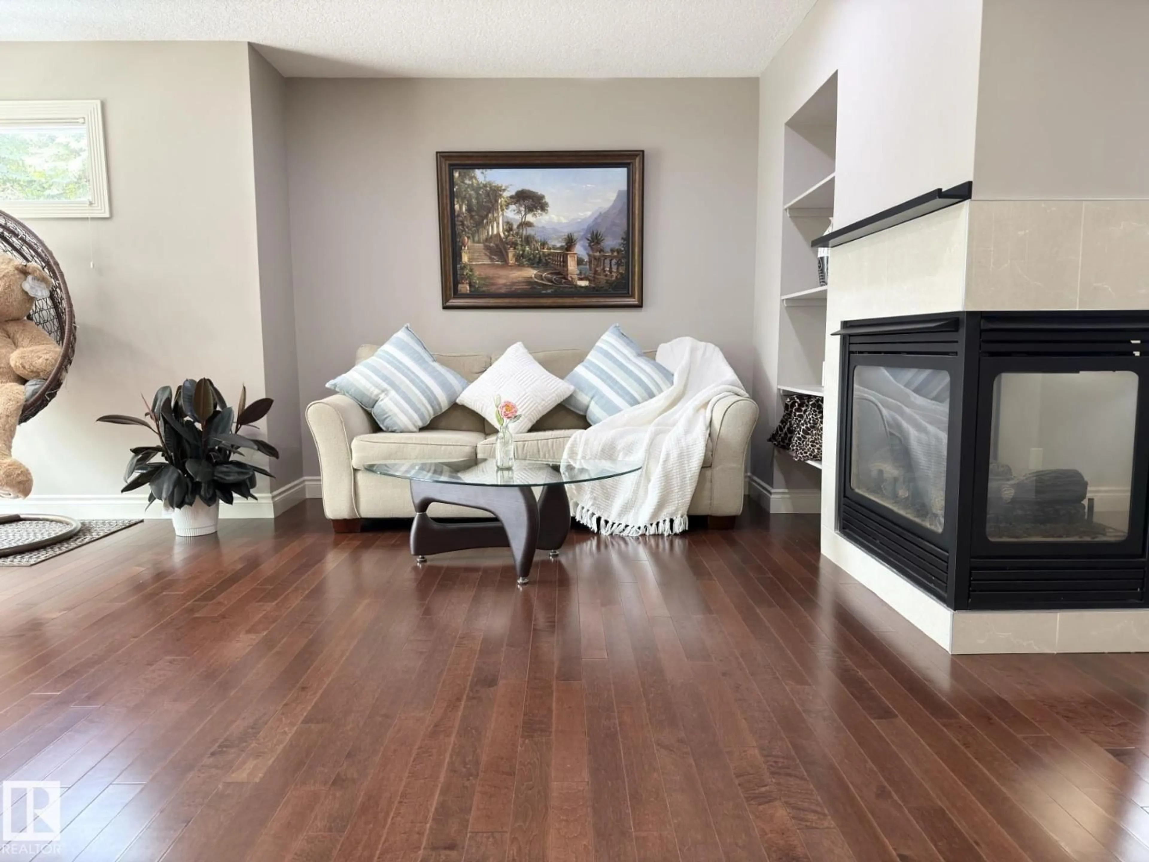 Living room with furniture, wood/laminate floor for 11342 79 AV, Edmonton Alberta T6G0P3