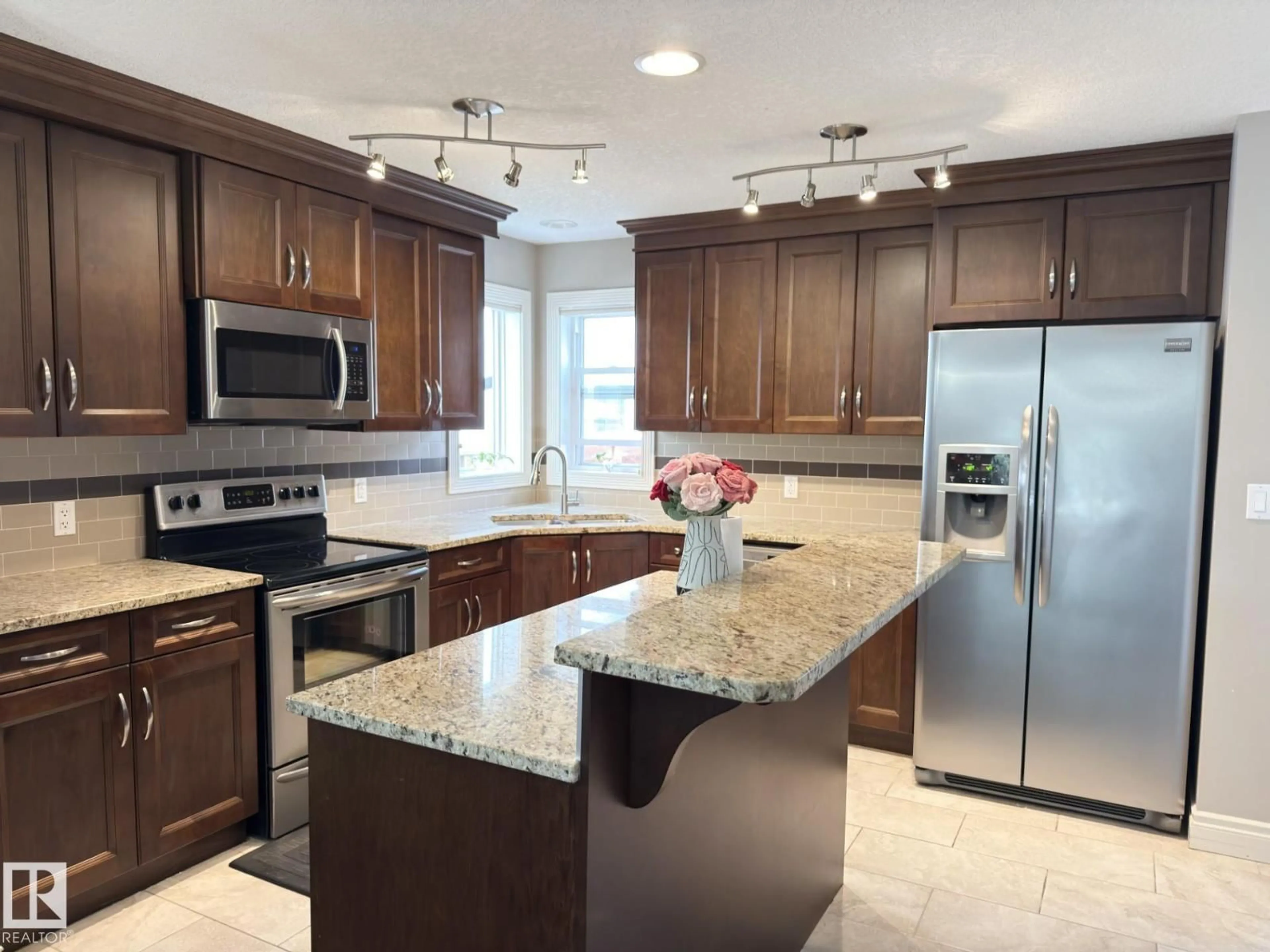 Open concept kitchen, ceramic/tile floor for 11342 79 AV, Edmonton Alberta T6G0P3