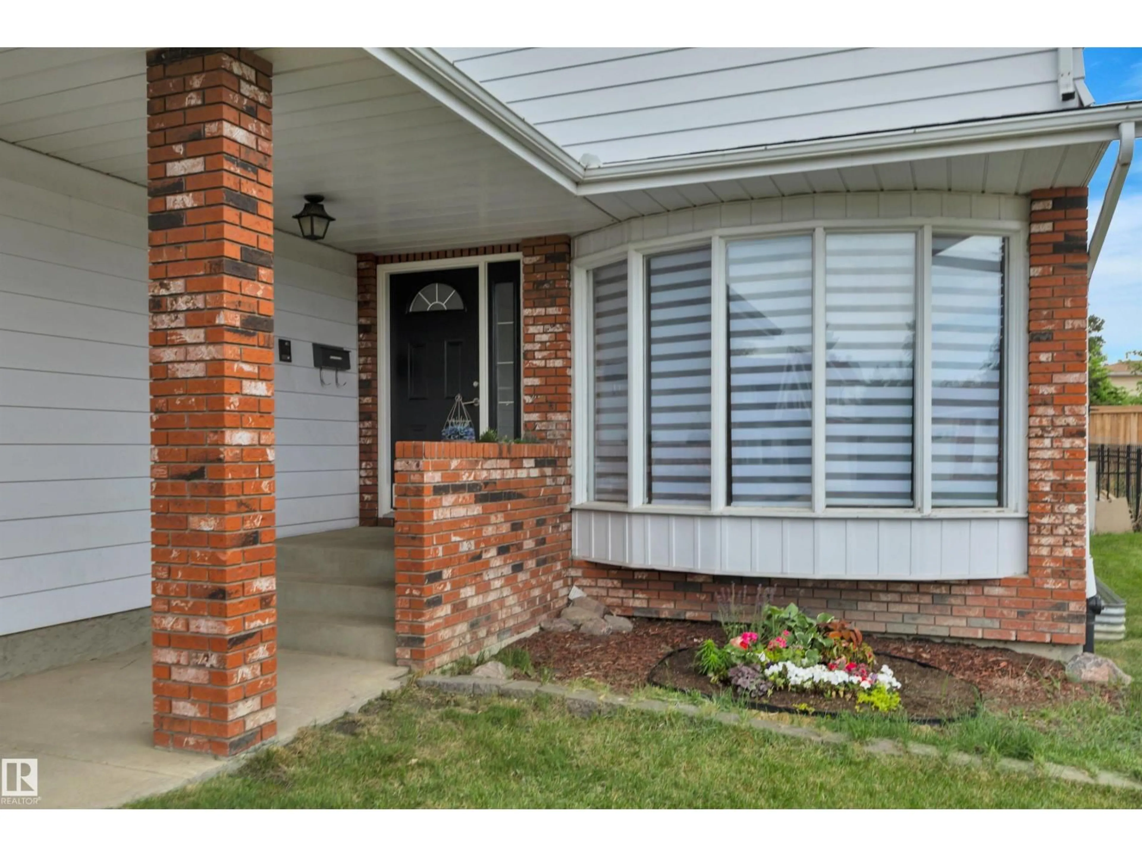 Home with brick exterior material, street for NW - 2412 112A ST, Edmonton Alberta T6J4W1