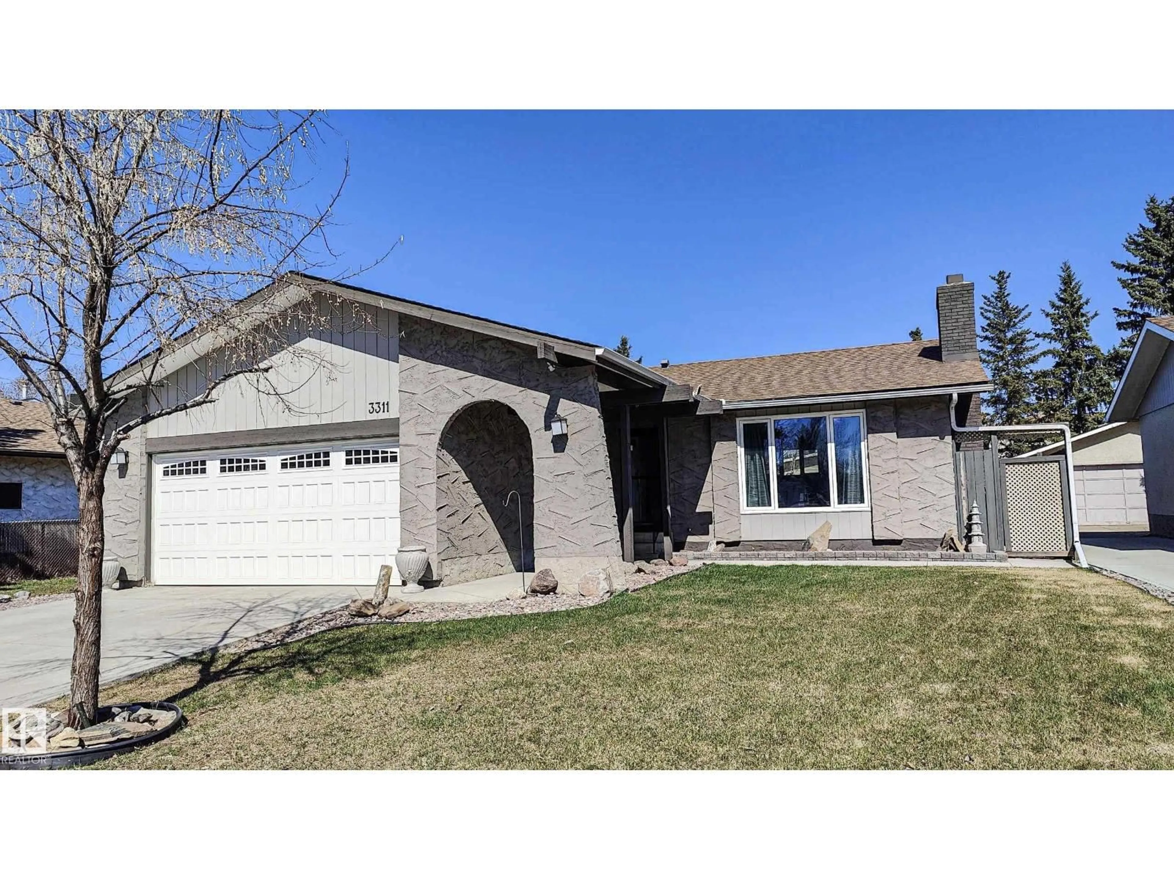Home with vinyl exterior material, street for NW - 3311 108 ST, Edmonton Alberta T5J3C9