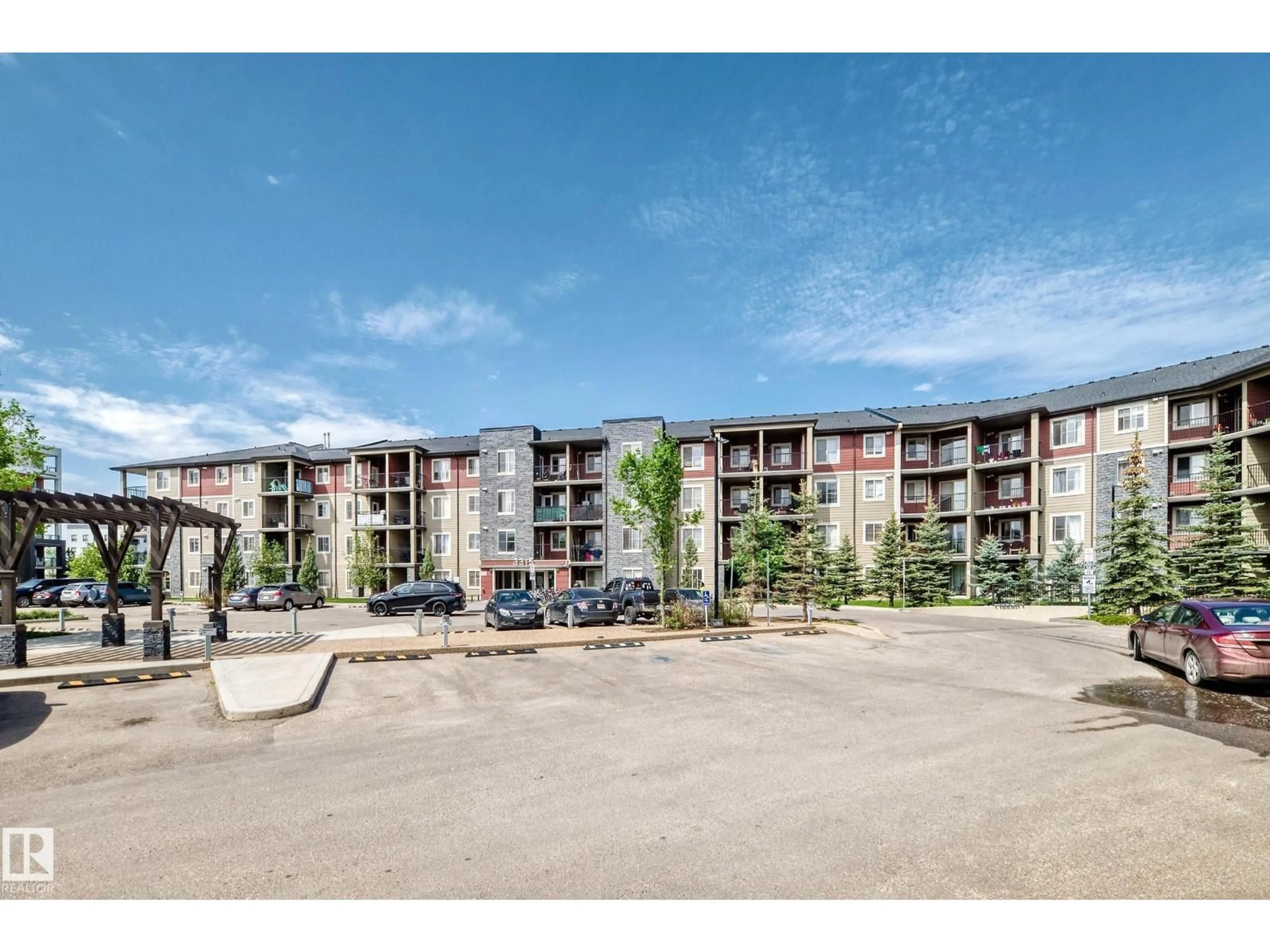 A pic from outside/outdoor area/front of a property/back of a property/a pic from drone, unknown for #103 - 3315 JAMES MOWATT TR, Edmonton Alberta T6W3L9