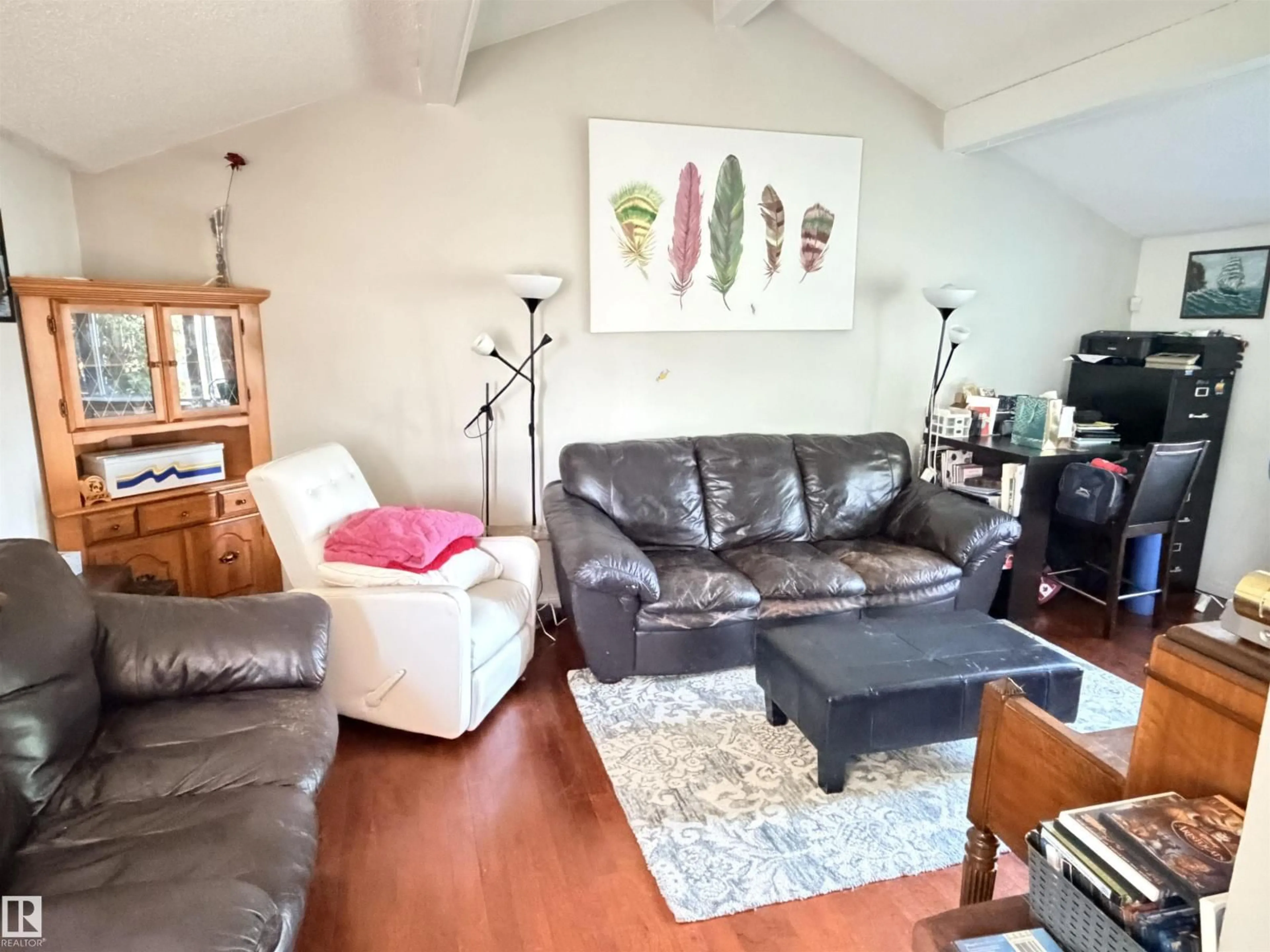 Living room with furniture, wood/laminate floor for 4823 49 ST, Clyde Alberta T0G0P0