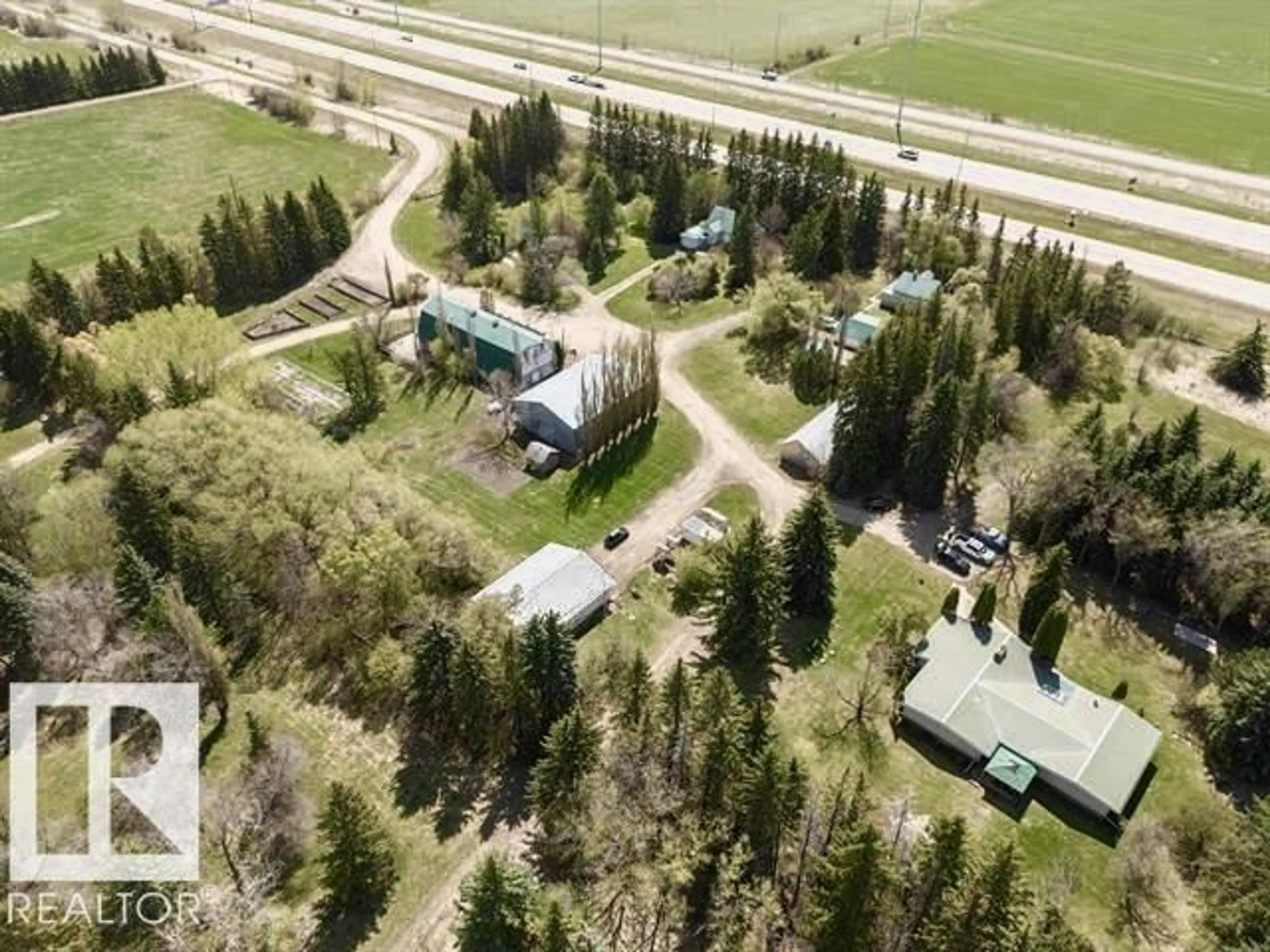A pic from outside/outdoor area/front of a property/back of a property/a pic from drone, street for 23242 HWY 14, Rural Strathcona County Alberta T6B1E6
