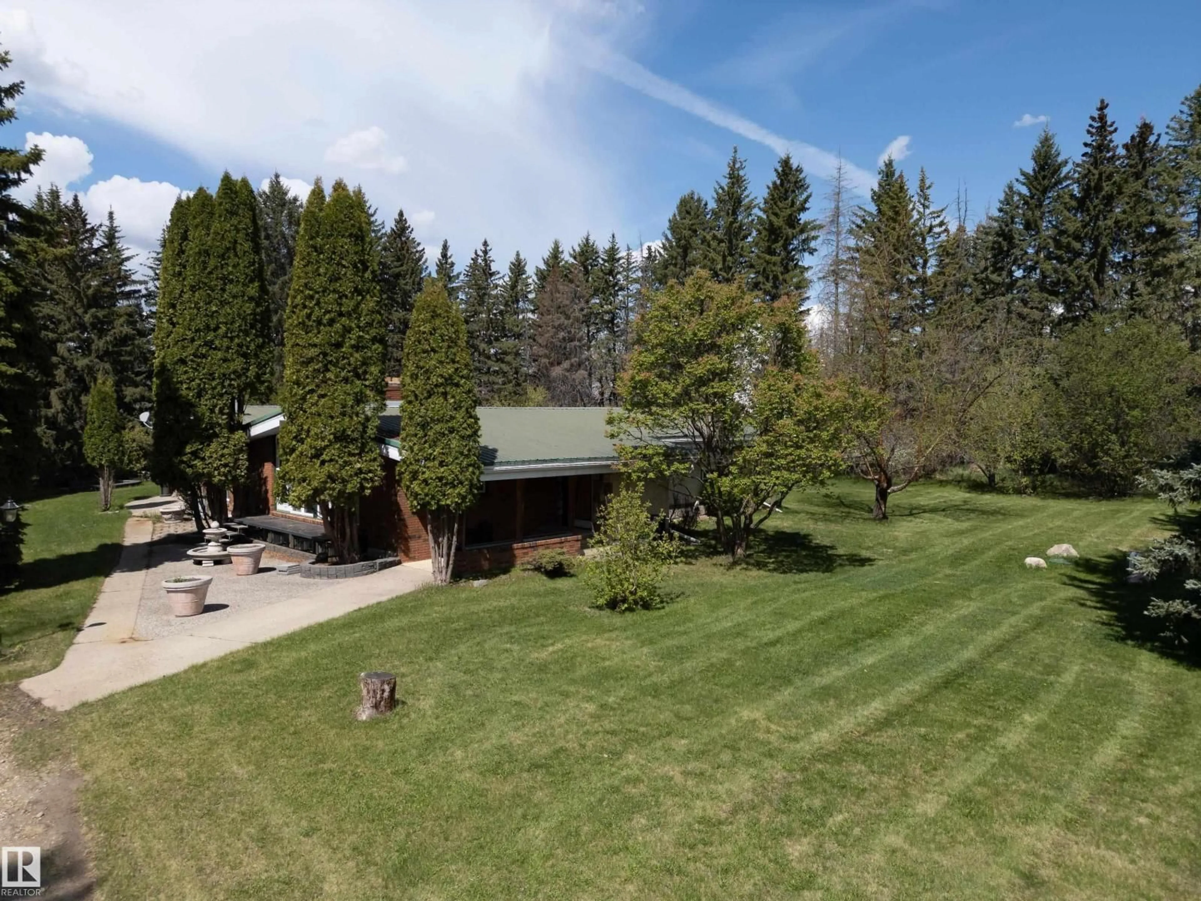 A pic from outside/outdoor area/front of a property/back of a property/a pic from drone, forest/trees view for 23242 HWY 14, Rural Strathcona County Alberta T6B1E6