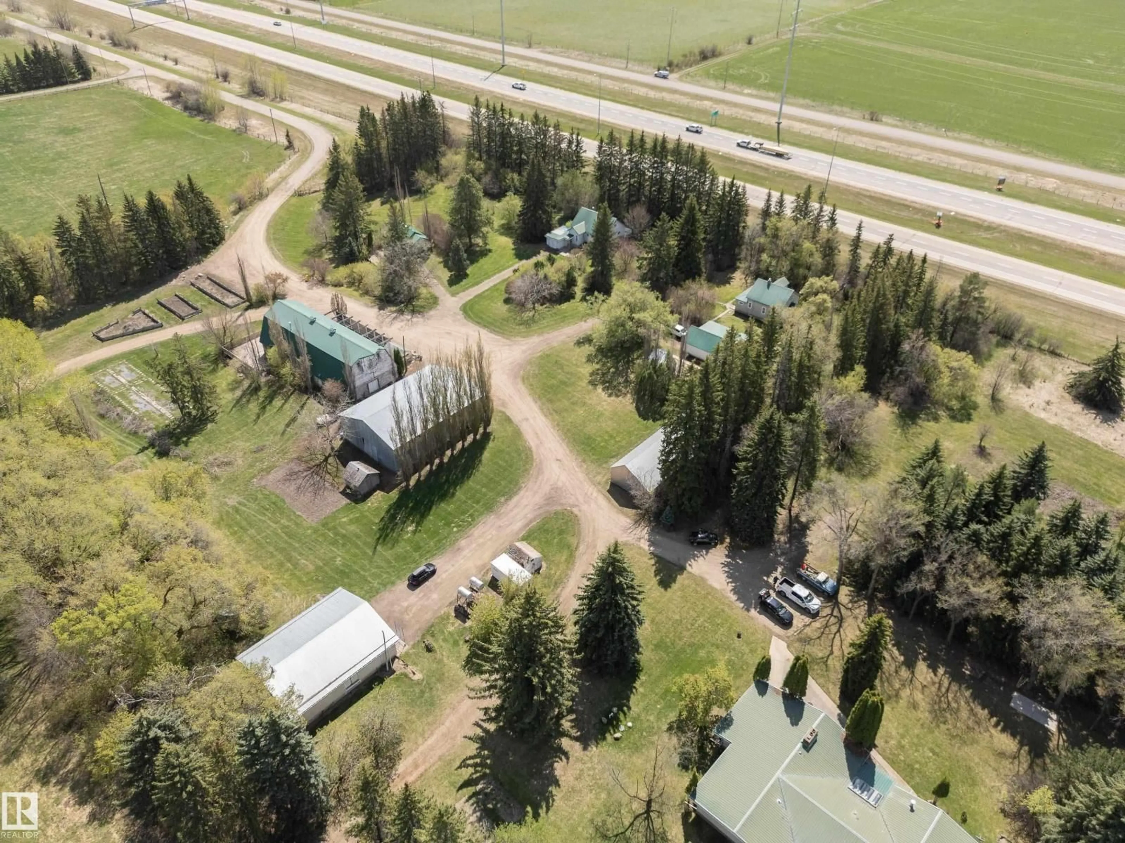 A pic from outside/outdoor area/front of a property/back of a property/a pic from drone, unknown for 23242 HWY 14, Rural Strathcona County Alberta T6B1E6