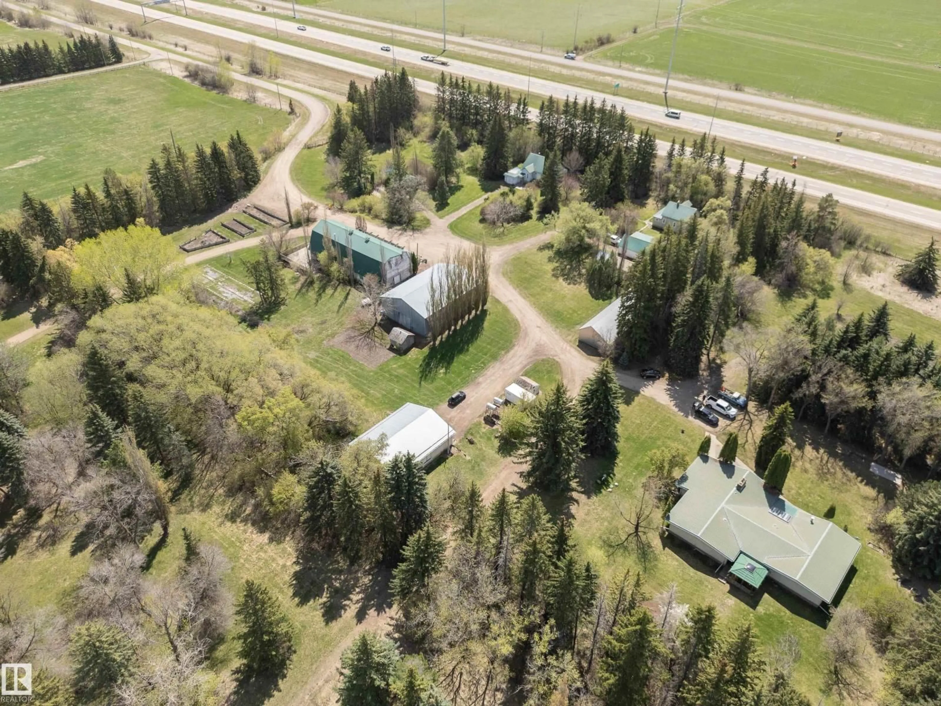 A pic from outside/outdoor area/front of a property/back of a property/a pic from drone, unknown for 23242 HWY 14, Rural Strathcona County Alberta T6B1E6