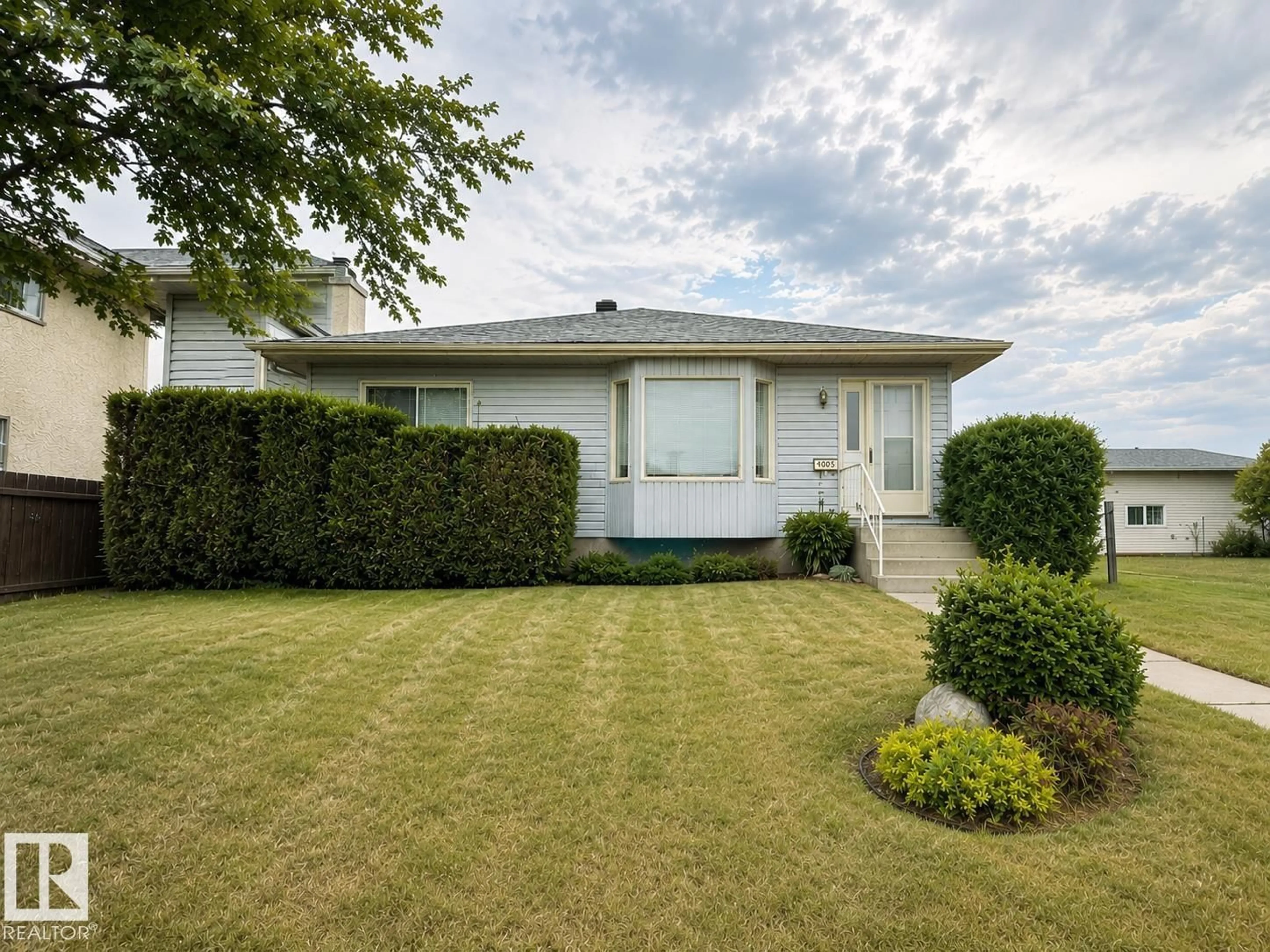 Home with vinyl exterior material, street for 4005 55 AV, Whitecourt Alberta T7S1C5