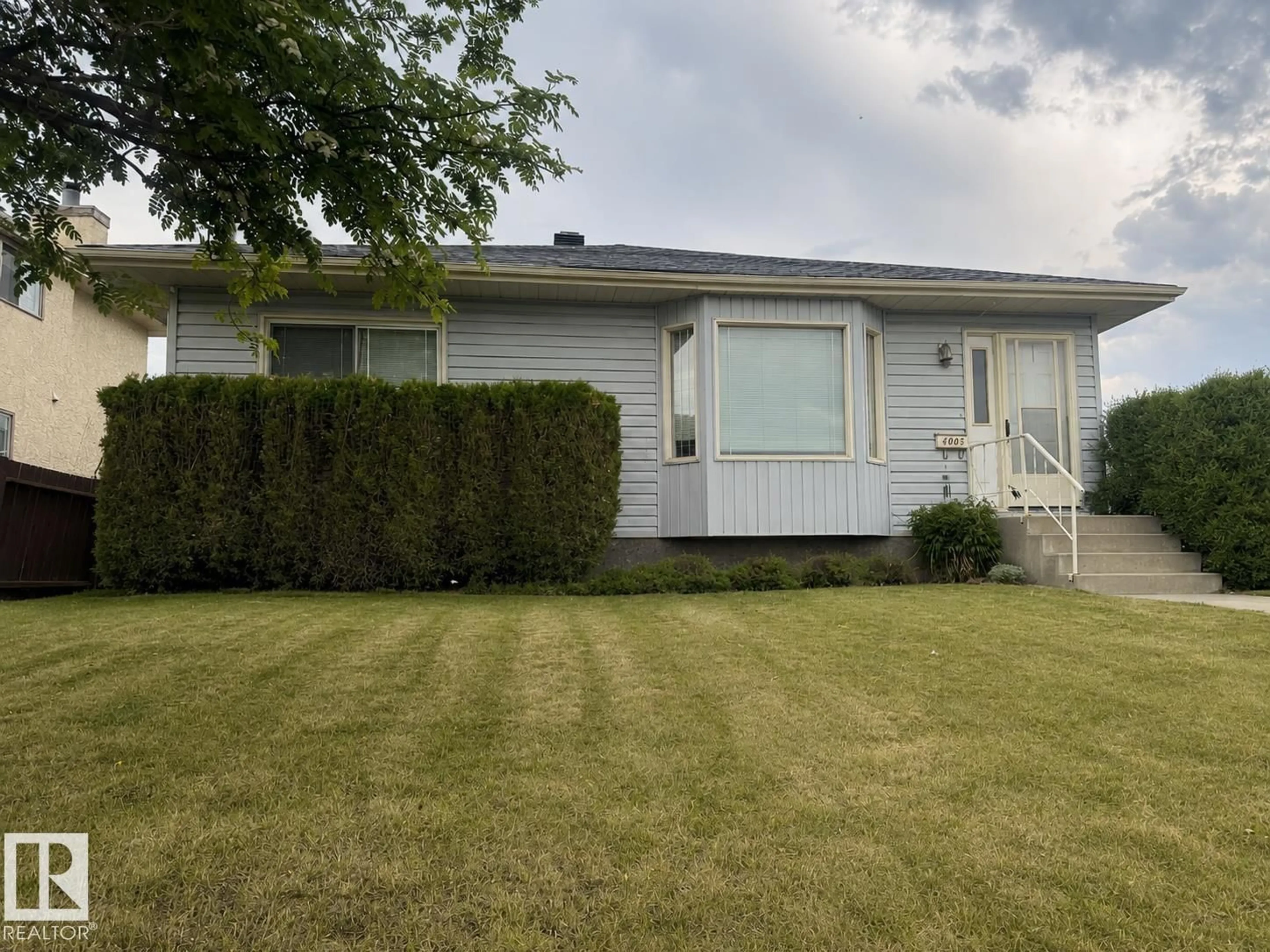 Home with vinyl exterior material, street for 4005 55 AV, Whitecourt Alberta T7S1C5