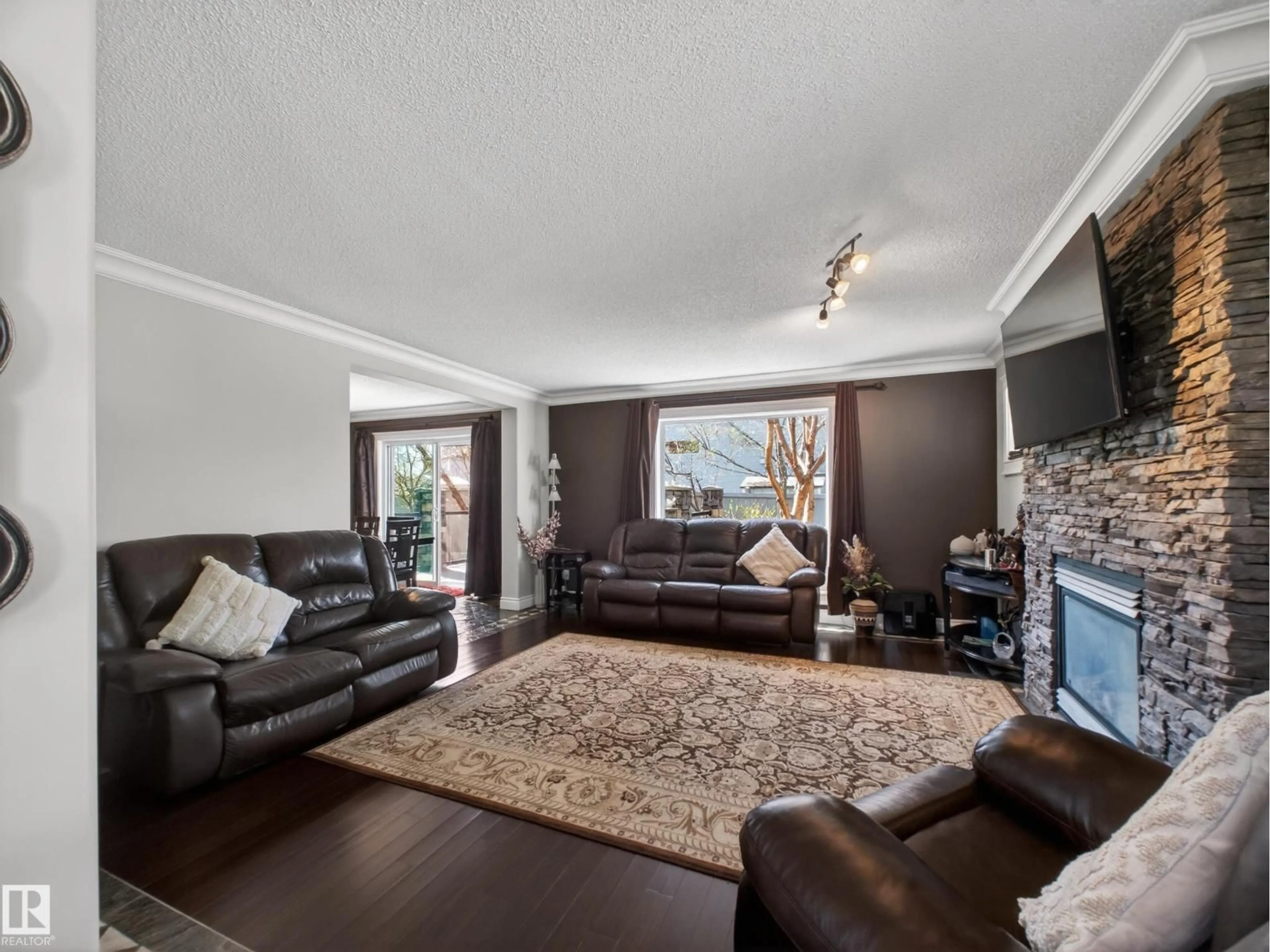 Living room with furniture, wood/laminate floor for 40 ENGLISH WY, St. Albert Alberta T8N7G7