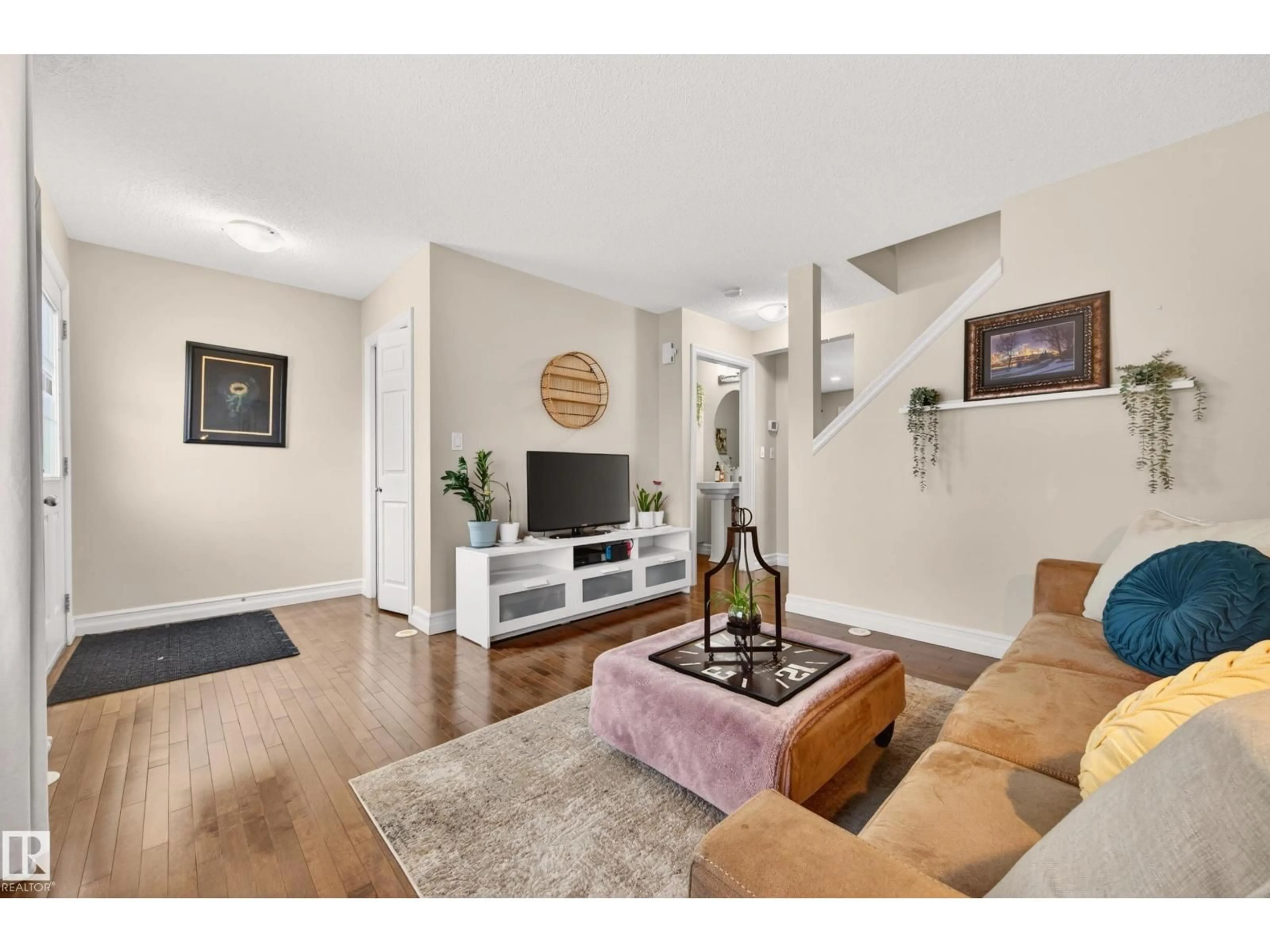 Living room with furniture, wood/laminate floor for 219 - 133 CHARLOTTE WY, Sherwood Park Alberta T8T0T3