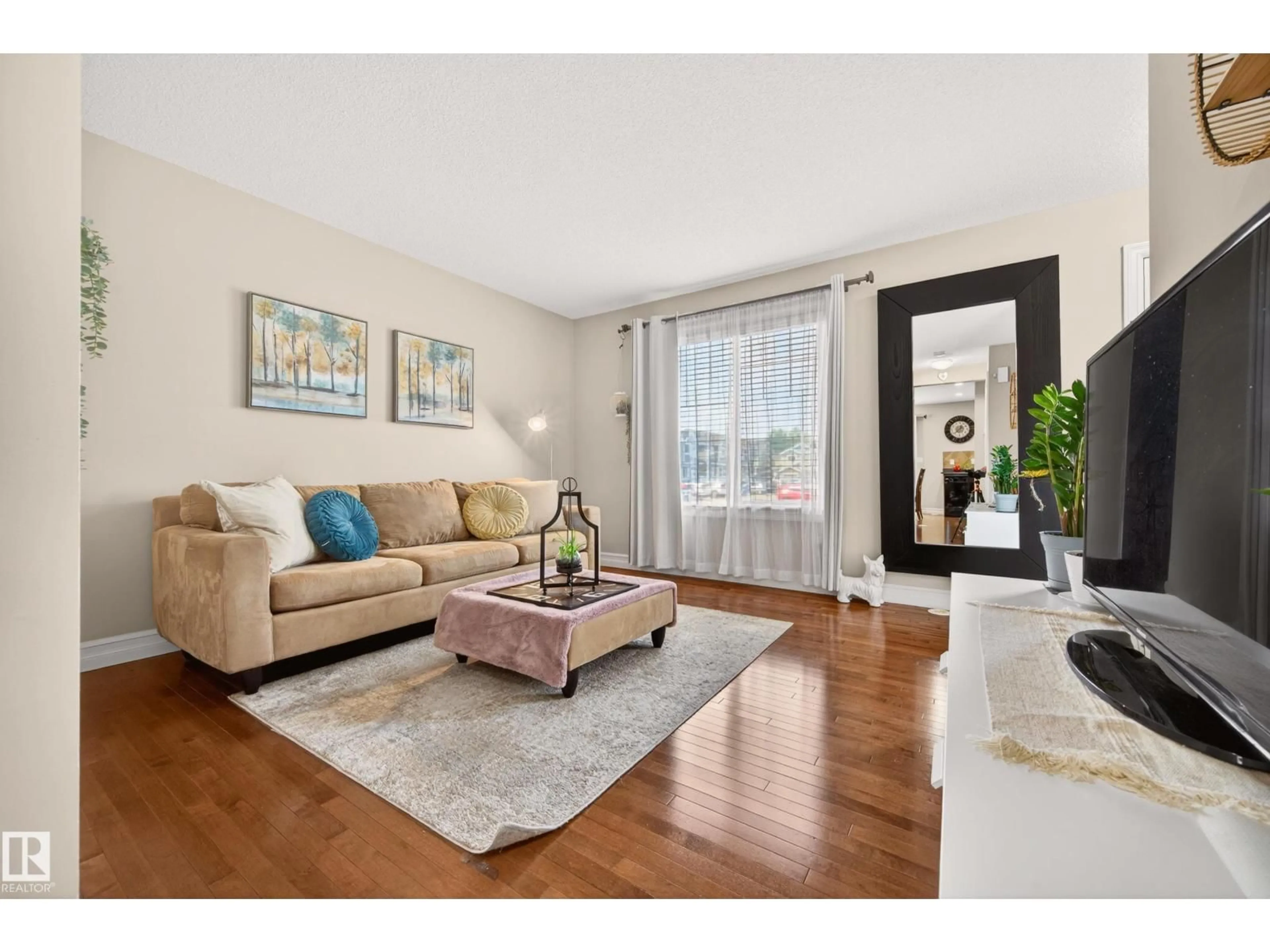 Living room with furniture, wood/laminate floor for 219 - 133 CHARLOTTE WY, Sherwood Park Alberta T8T0T3